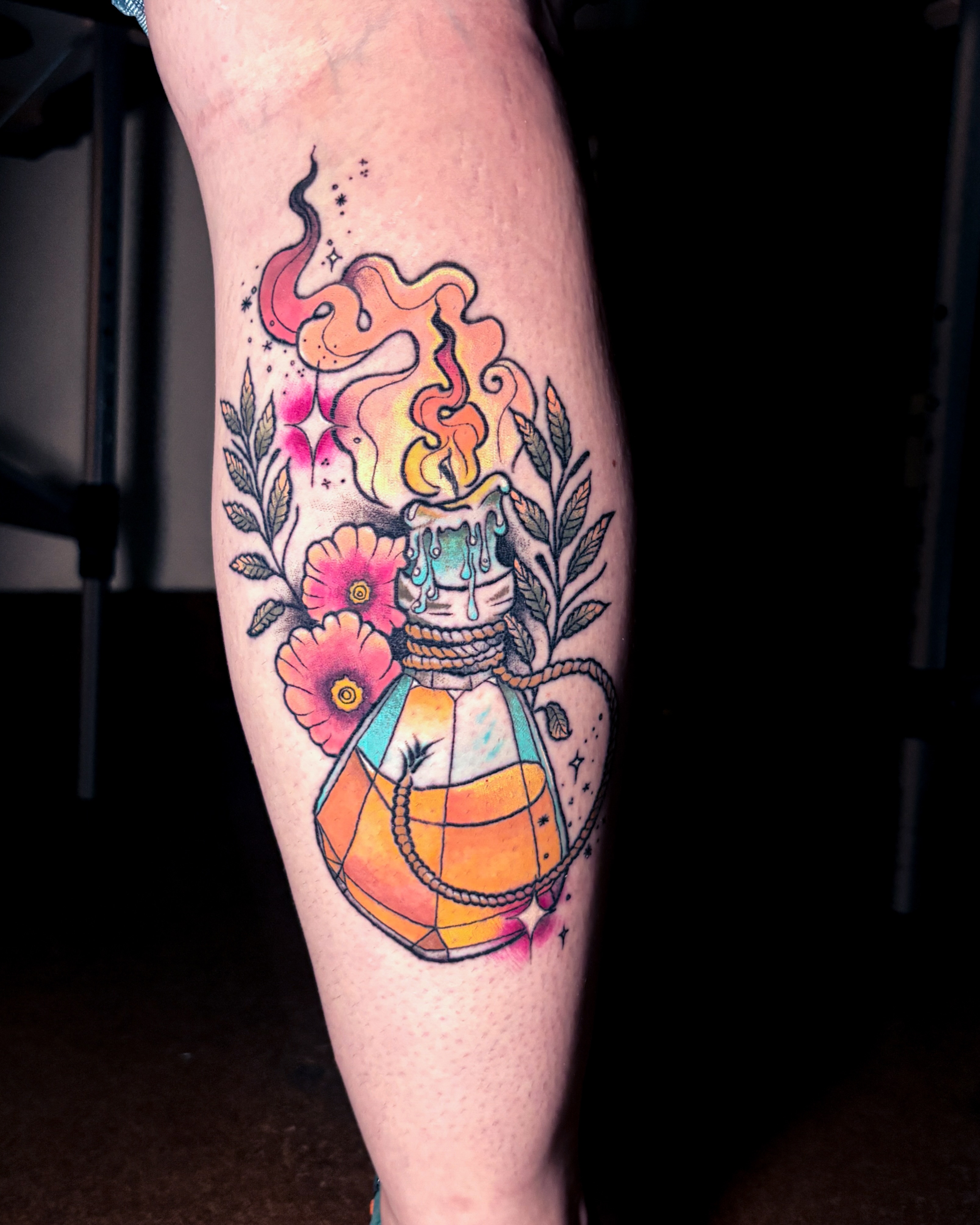 Candle and flowers geometric tattoo on the forearm by Liz Cook