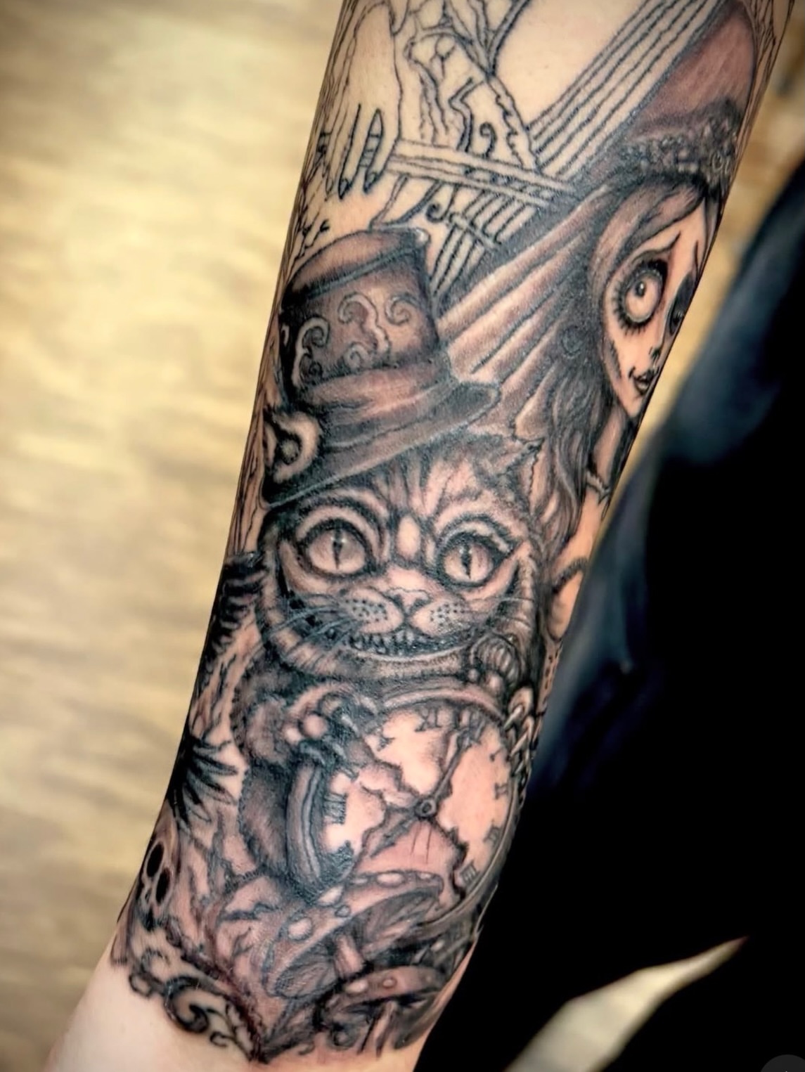 Cat wearing top hat realism tattoo on the forearm by Thom Johns-Green