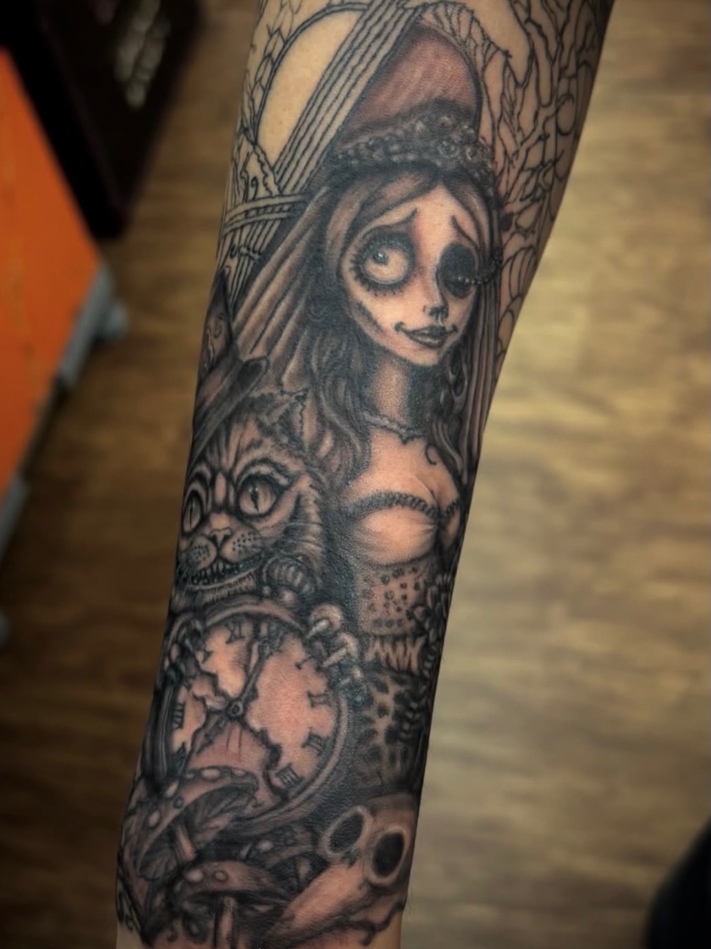Woman with cat realism tattoo on the forearm by Thom Johns-Green
