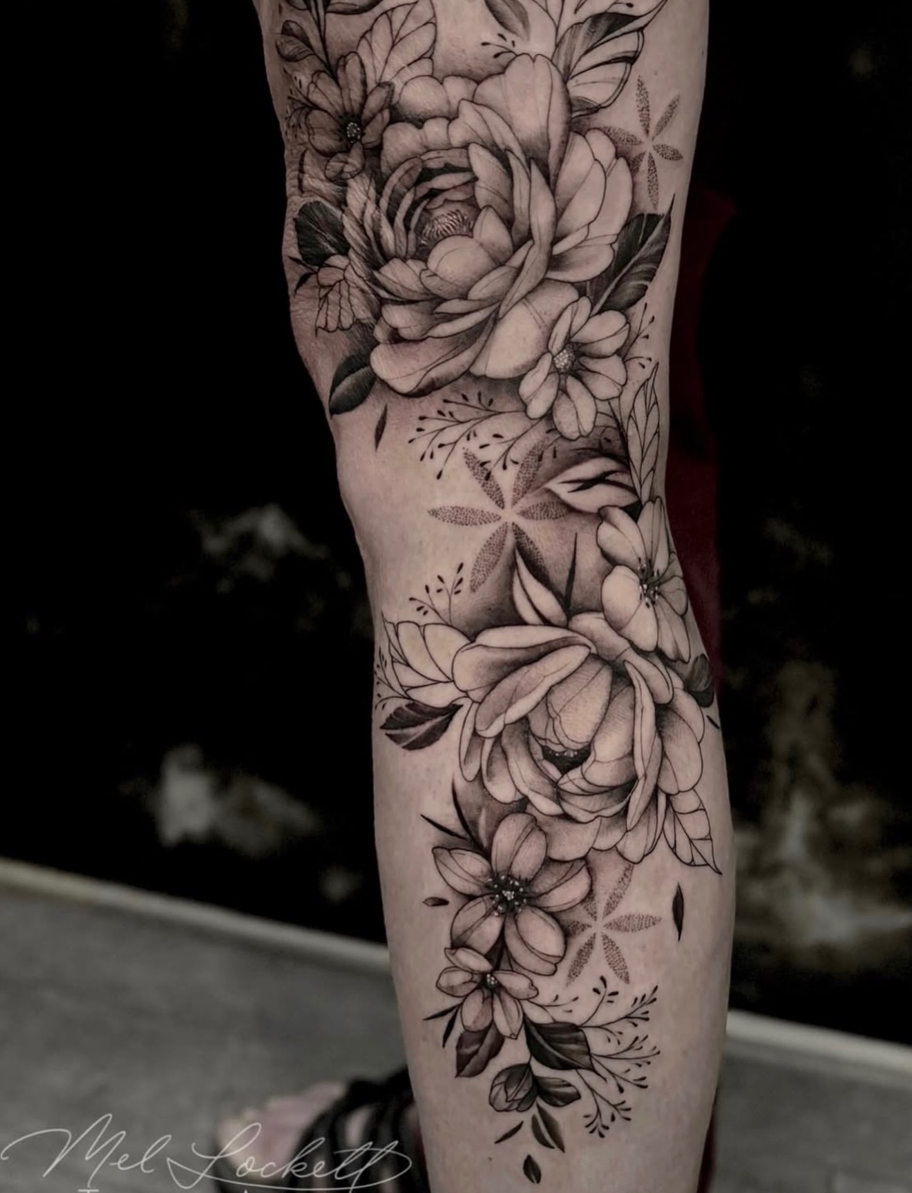 Floral bouquet black and grey tattoo on the forearm by Mel K Lockett - Nashville Tattoo Artist