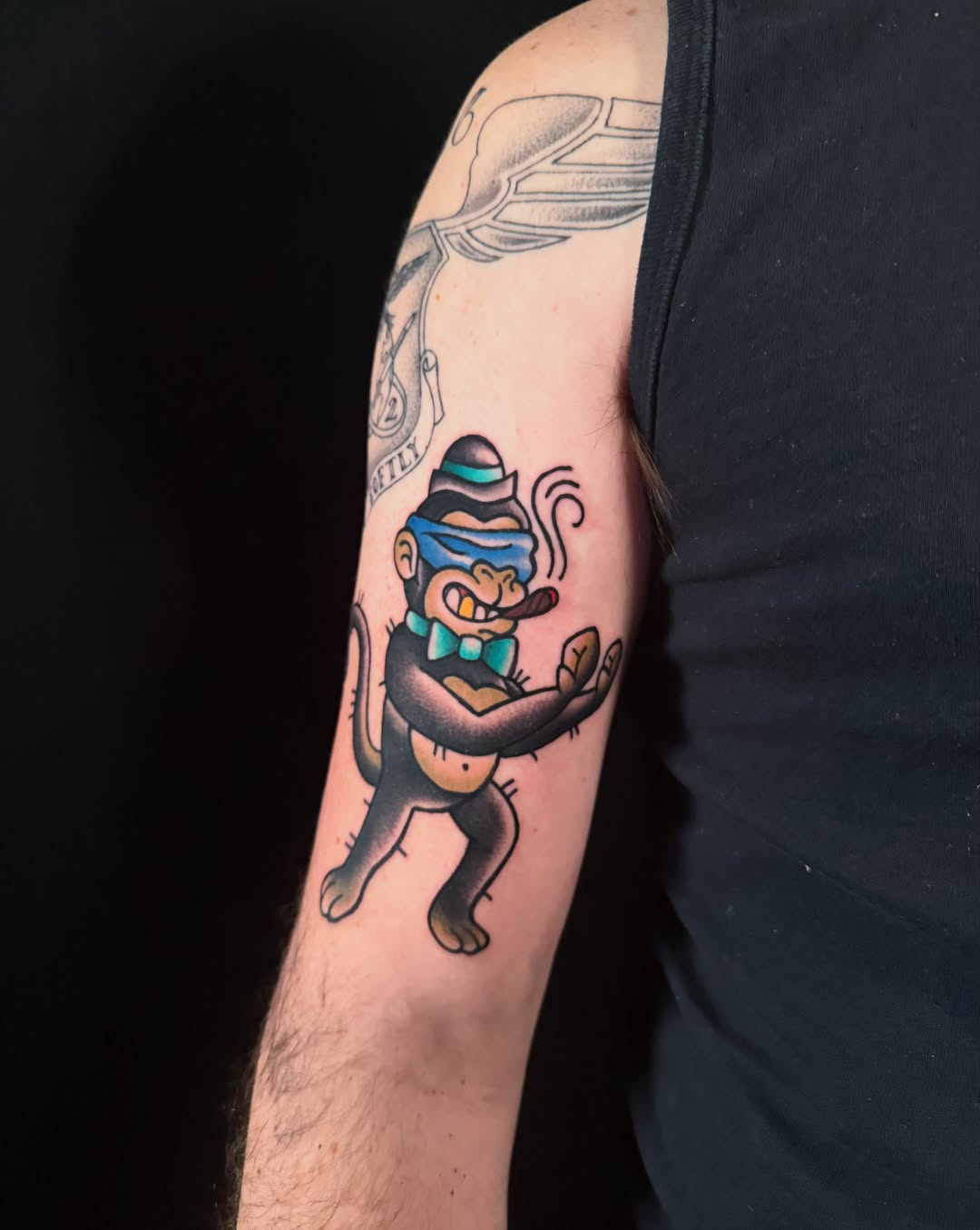 Monkey smoking pipe American traditional tattoo on the forearm by Jade Lewis