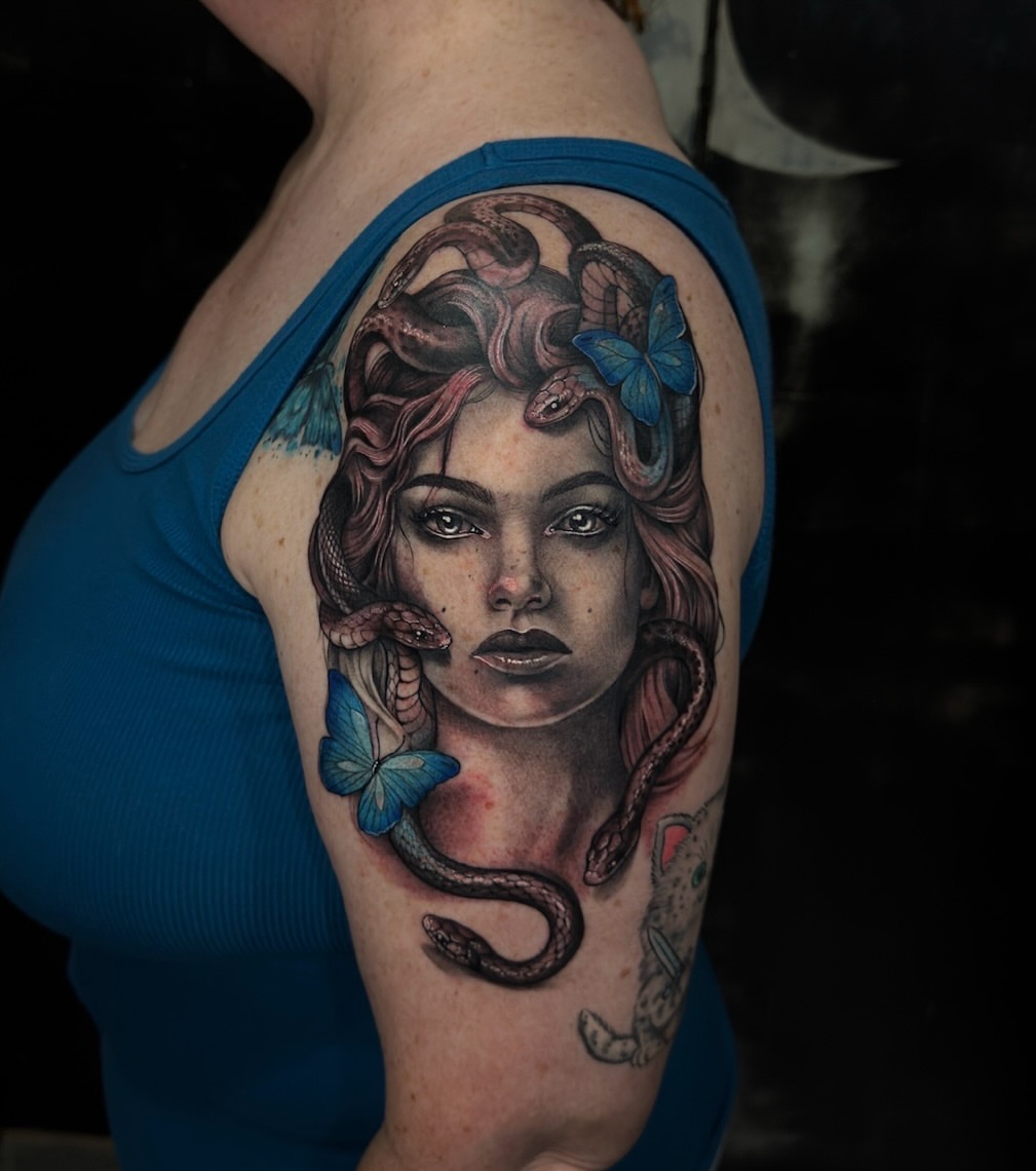 Woman with snakes and butterflies realism tattoo on the shoulder by Mel K Lockett - Nashville Tattoo Artist