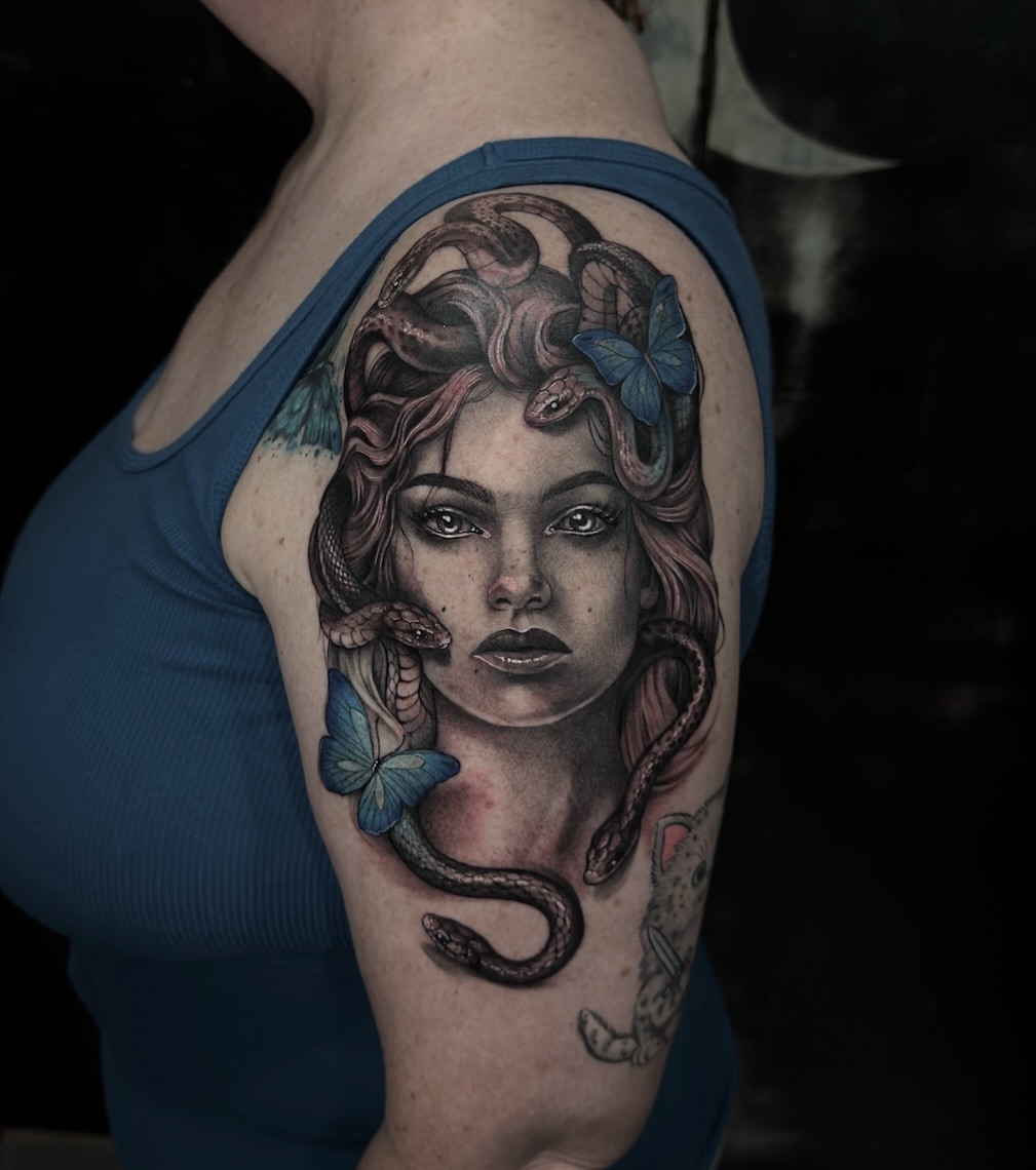 Woman with snakes realism tattoo on the shoulder by Mel K Lockett - Nashville Tattoo Artist
