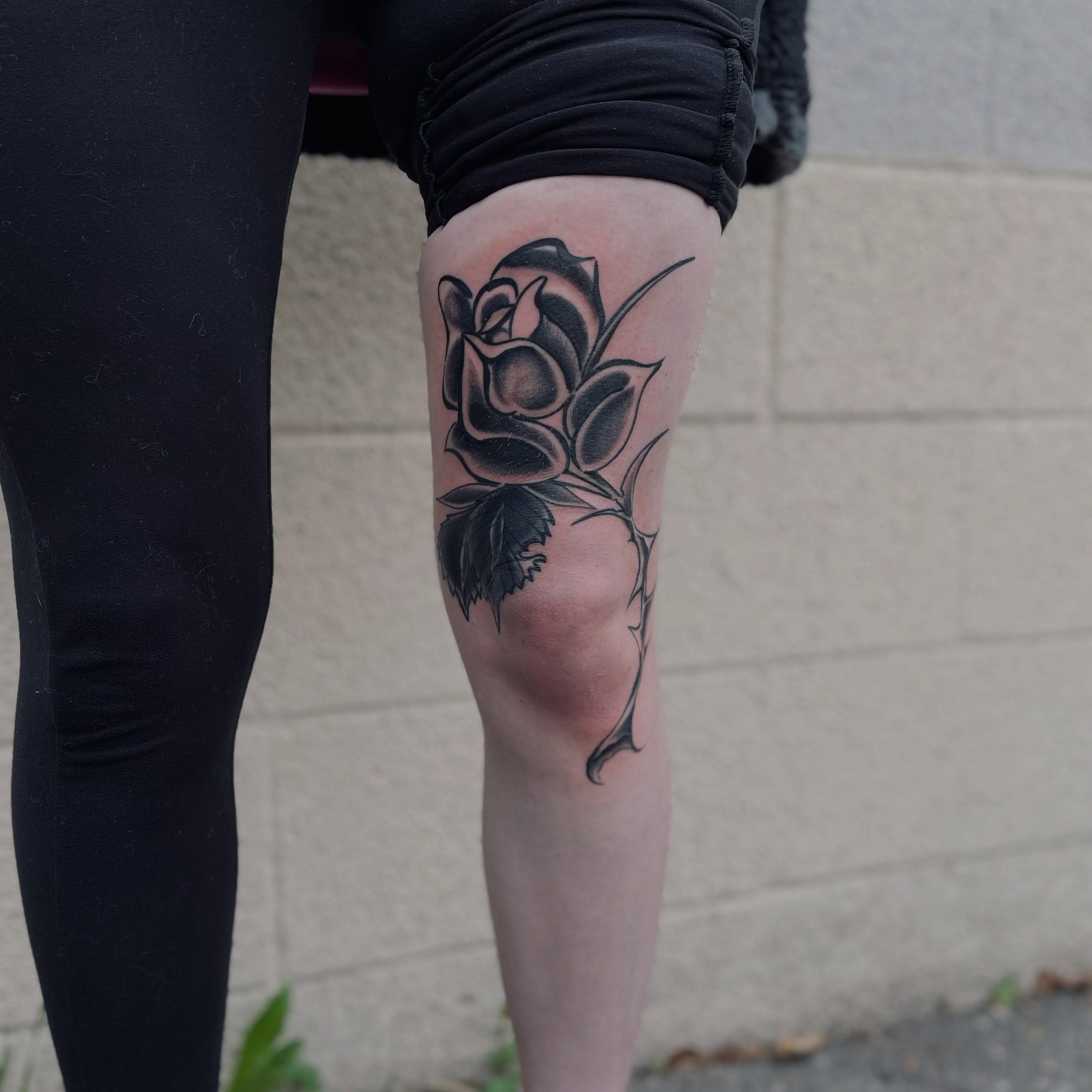 Rose black and grey tattoo on the thigh by Christien Xavier Alba, Salt Lake City, Utah