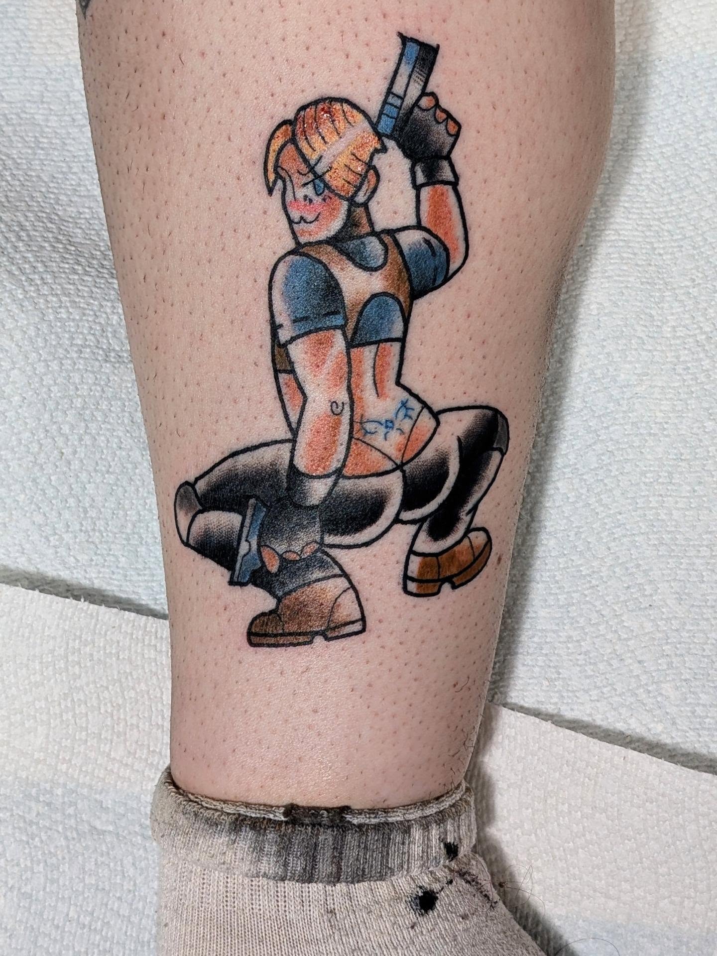 Character with gun American traditional tattoo on the forearm by norn noszka