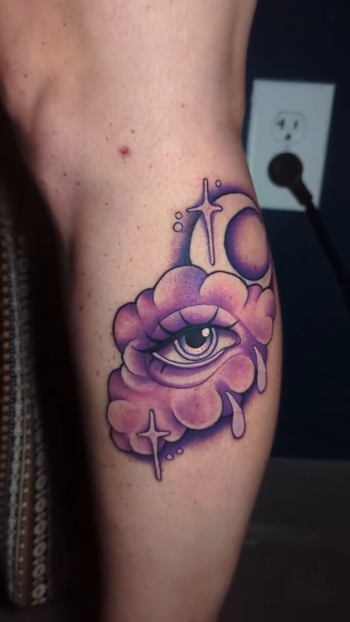 Crying cloud with eye and moon dotwork tattoo on the forearm by Narnia Gallagher