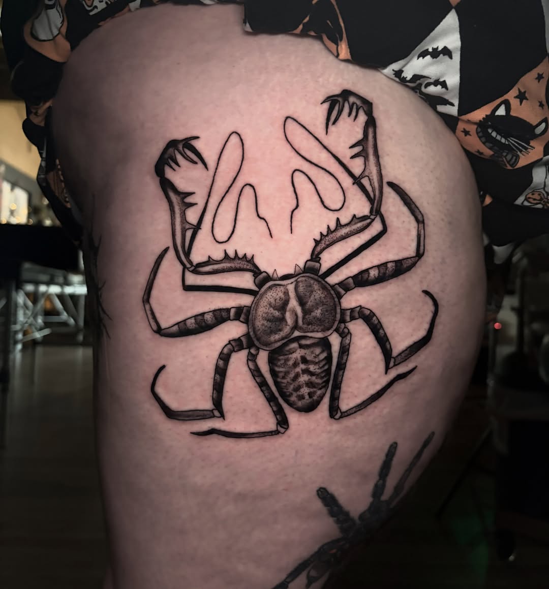 Spider black and grey tattoo on the thigh by Ashley Denise