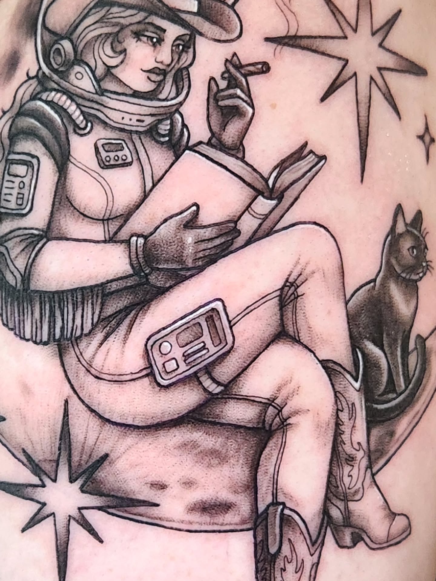 Astronaut reading American traditional tattoo on the thigh by Amanda Boyd - Duh!