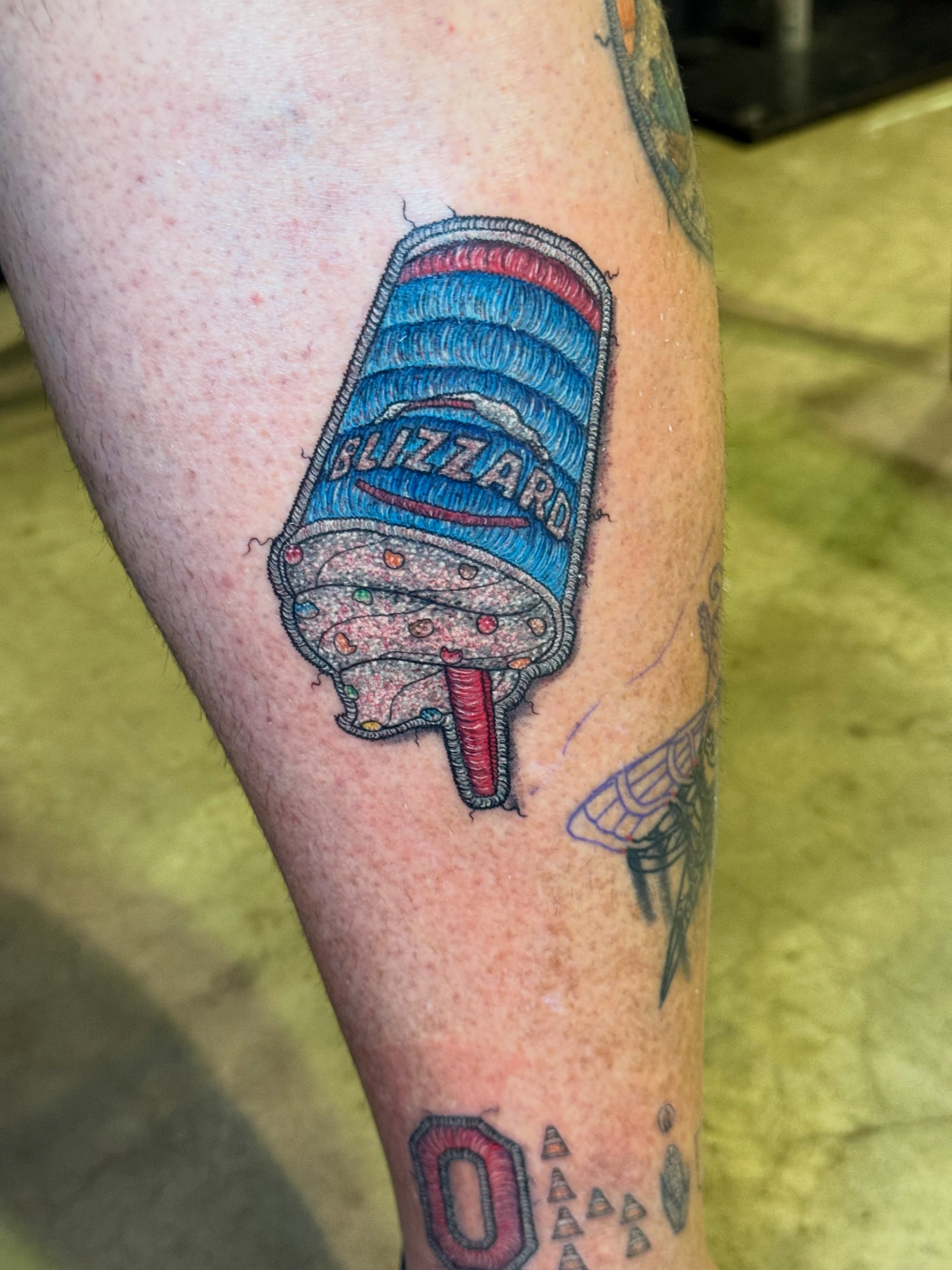 Blizzard ice cream realism tattoo on the forearm by Max
