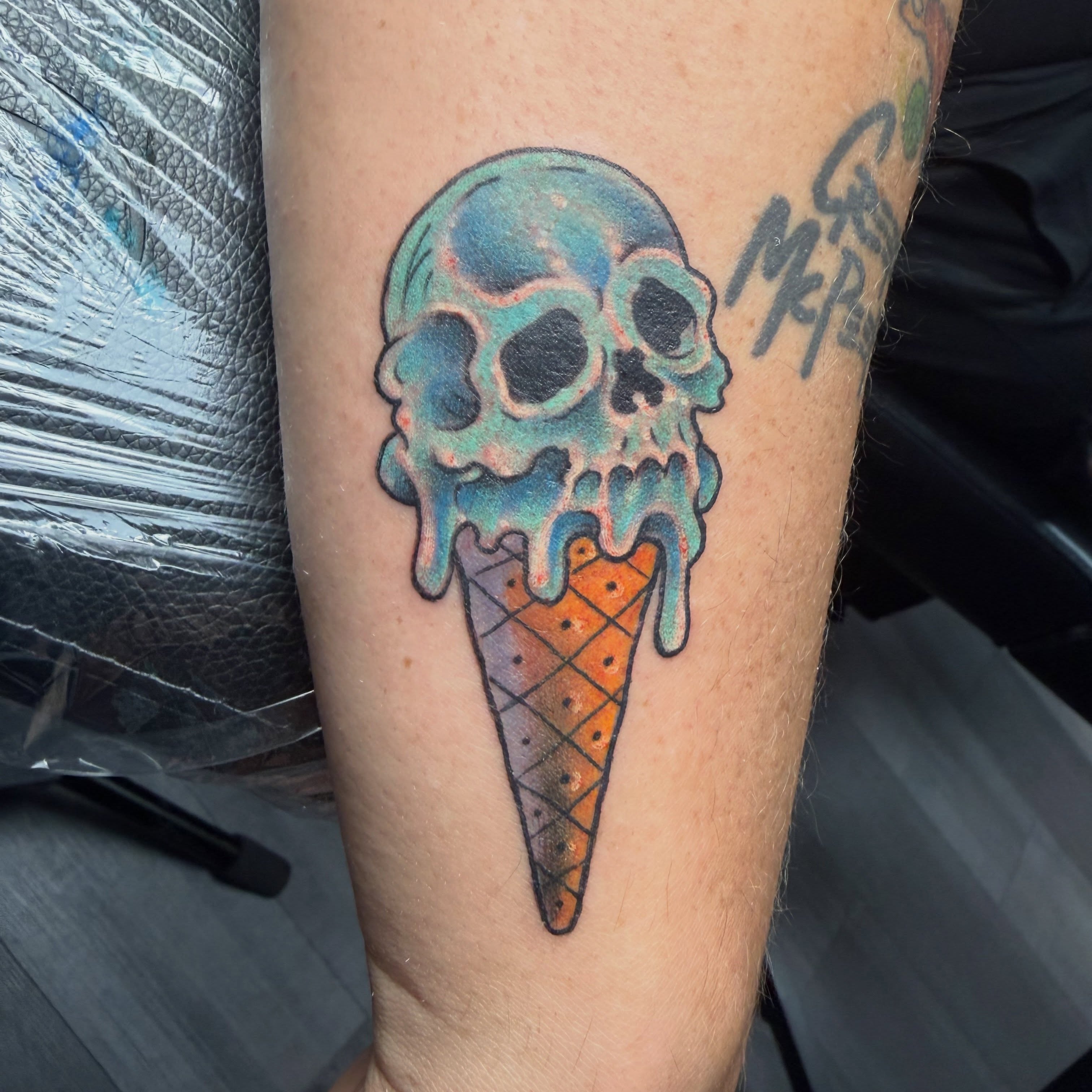 Ice cream cone skull American traditional tattoo on the forearm by Durb