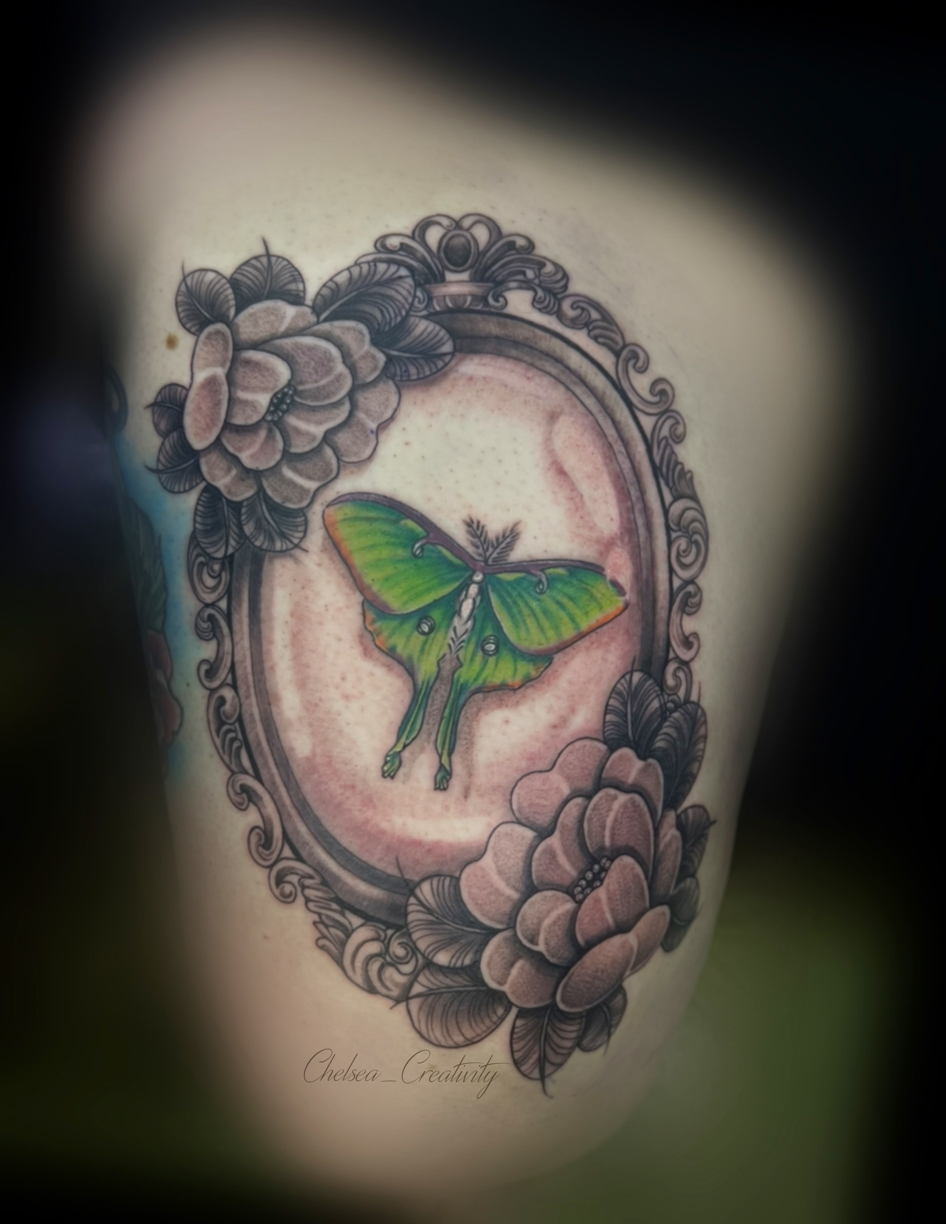 Green moth realism tattoo on the forearm by Chelsea Nichole