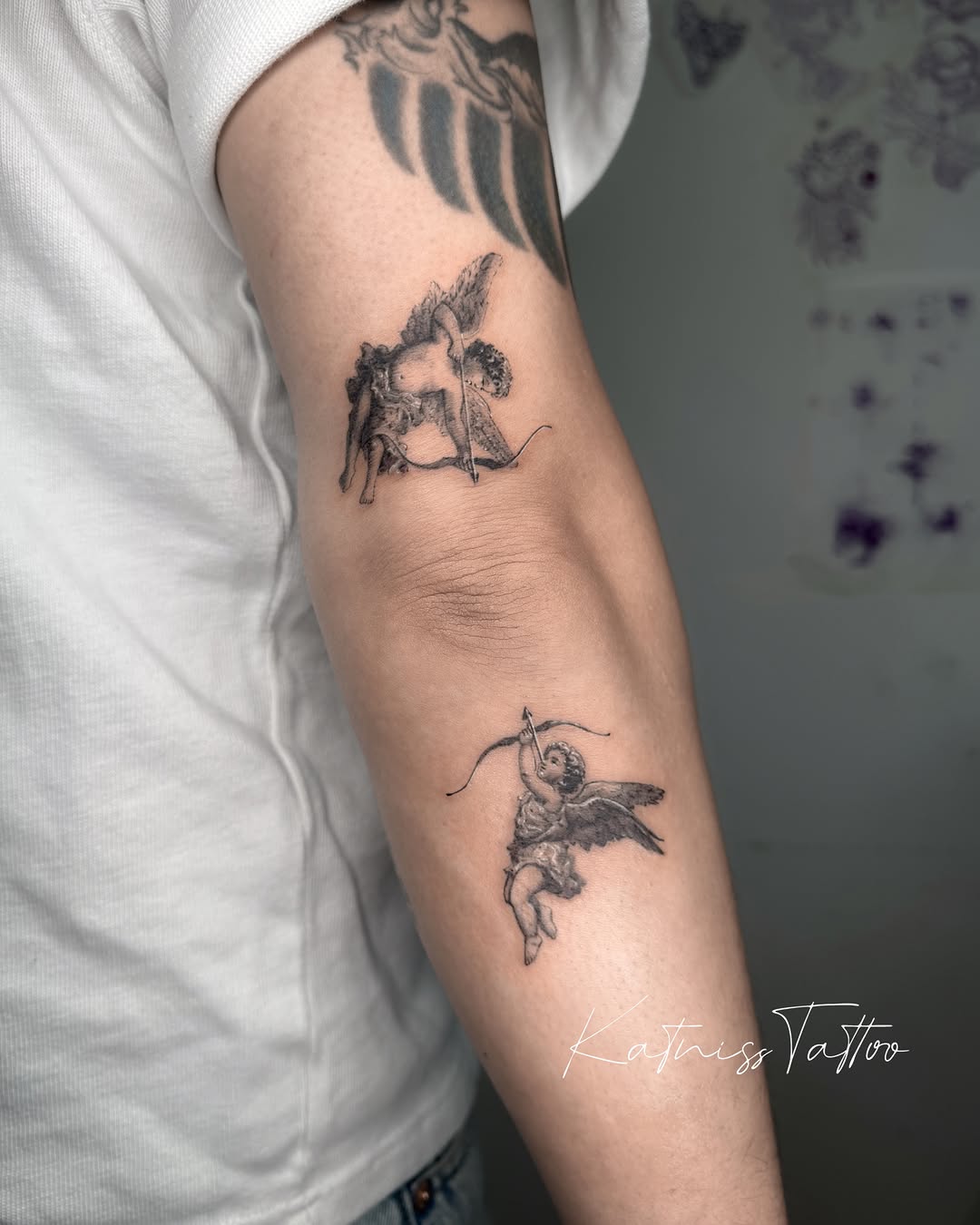 Cherub black and grey tattoo on the forearm by 𝙆𝙖𝙩𝙣𝙞𝙨𝙨