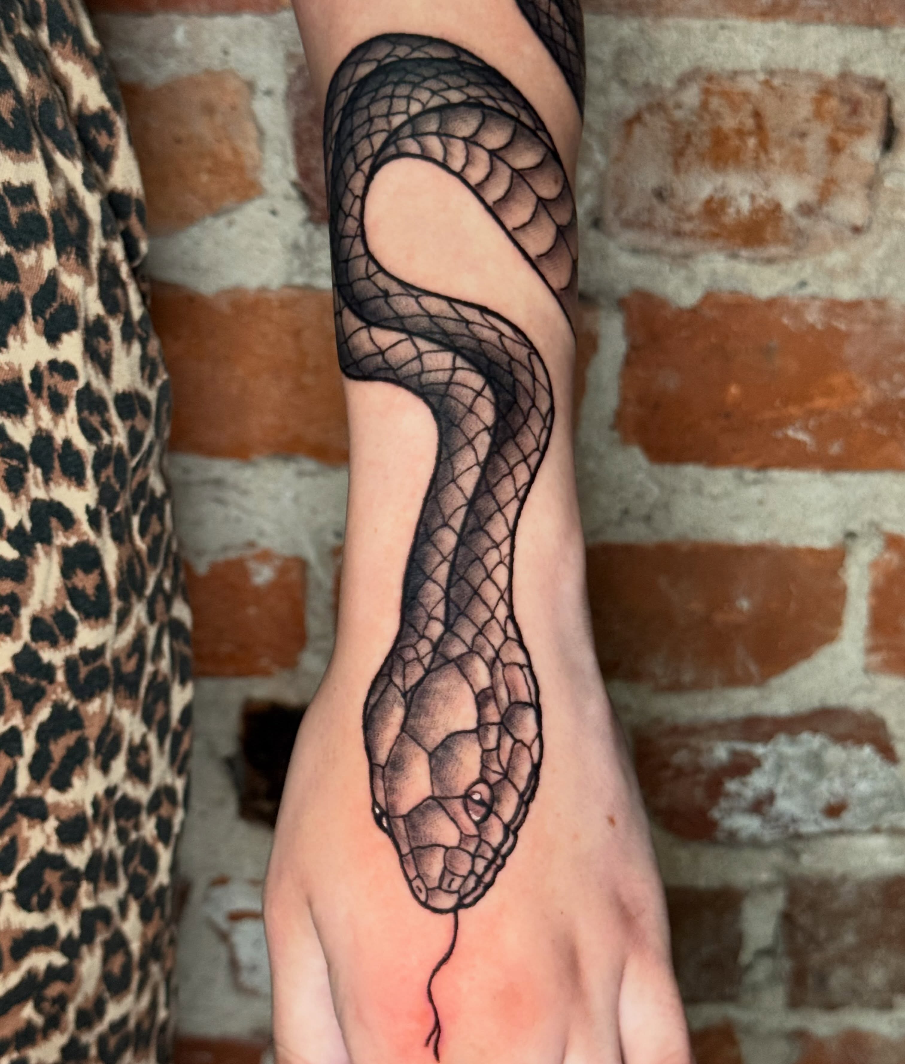 Snake black and grey tattoo on the forearm by CAT