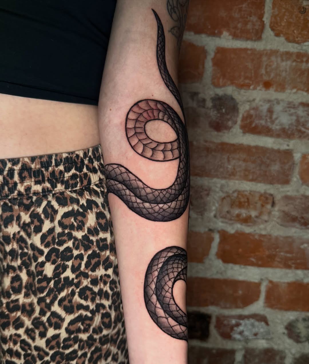 Snake black and grey tattoo on the forearm by CAT