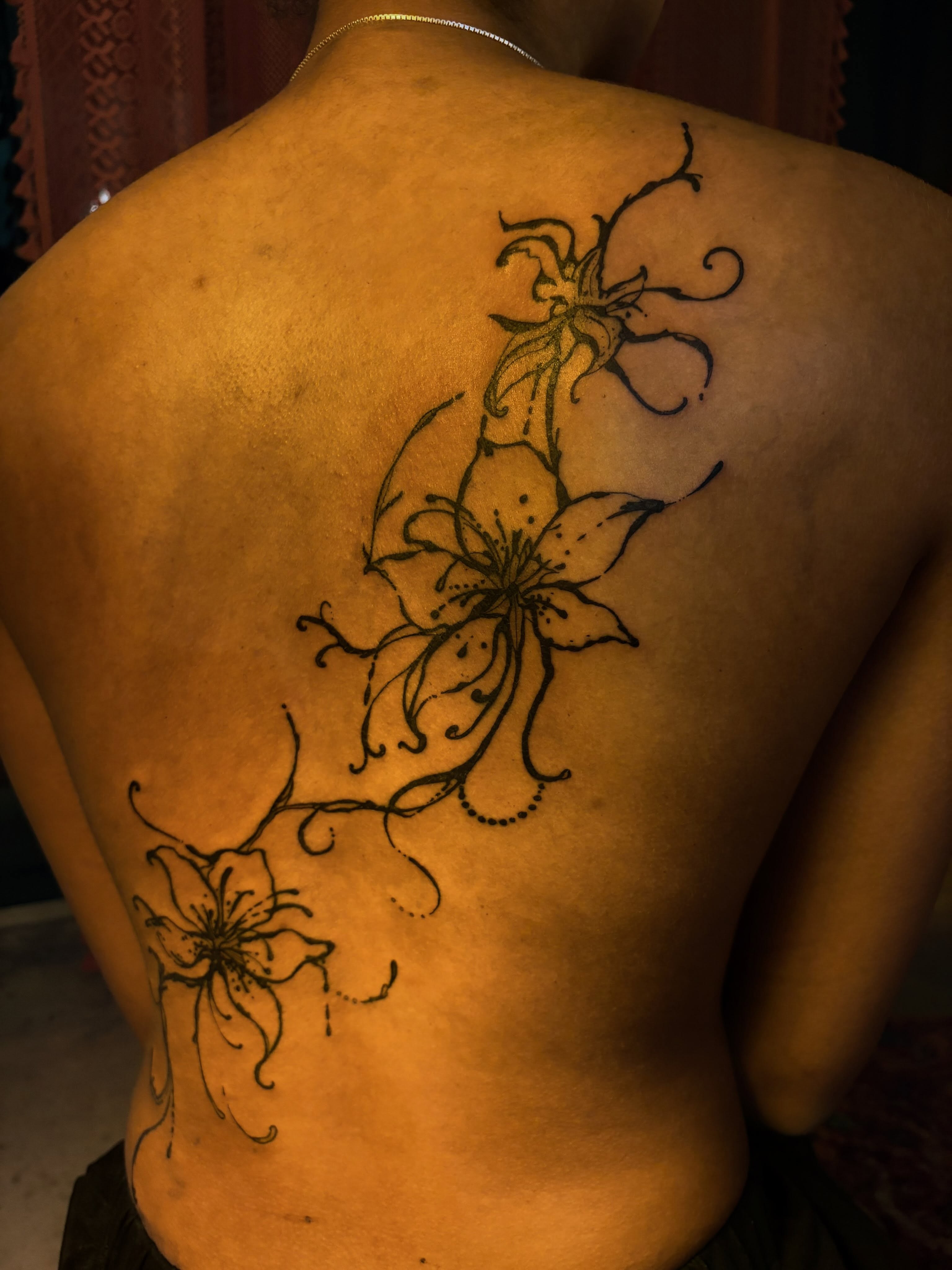 Lily flowers black and grey tattoo on the back by blastedbybk