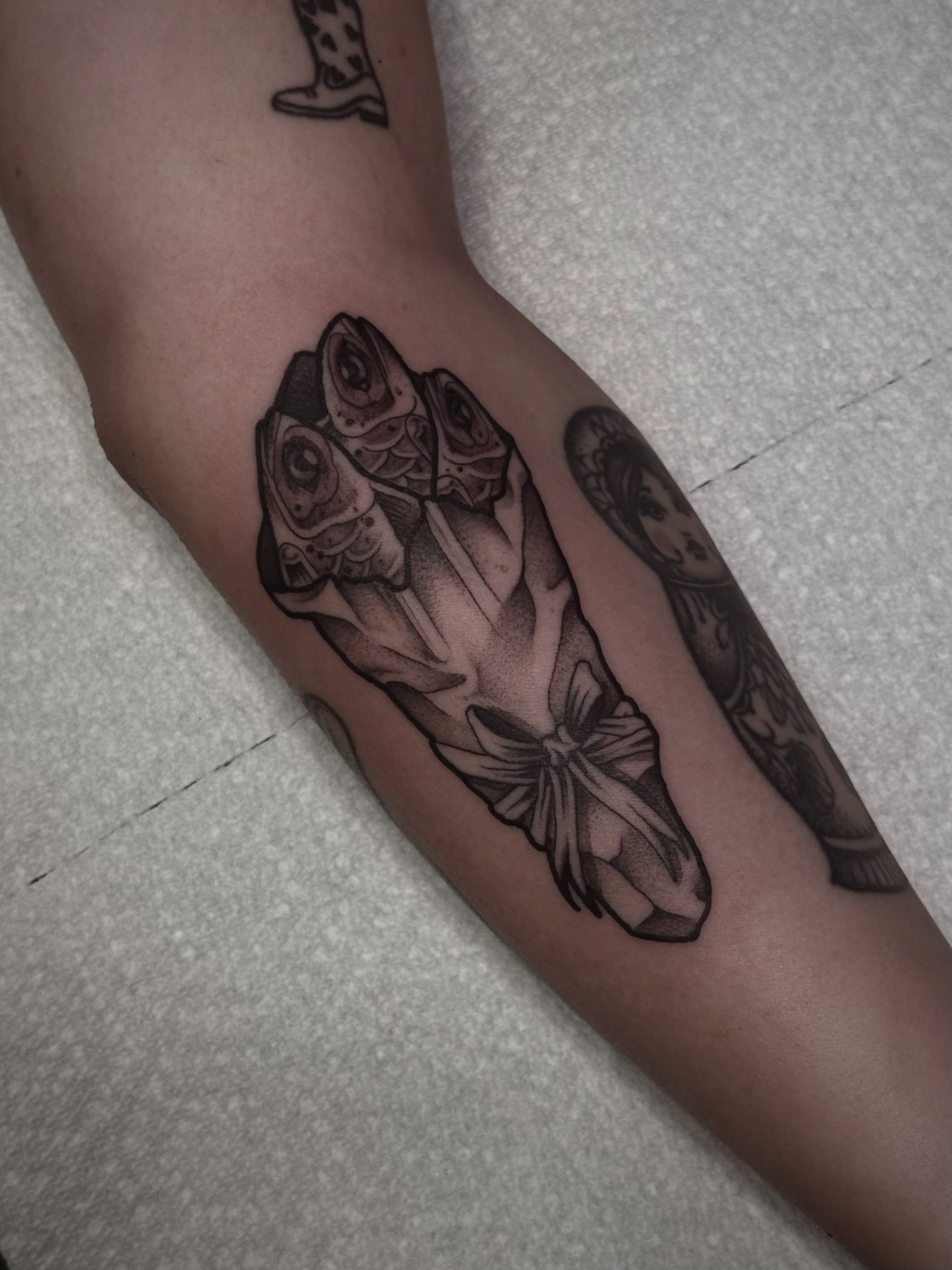 Fish black and grey tattoo on the forearm by K9
