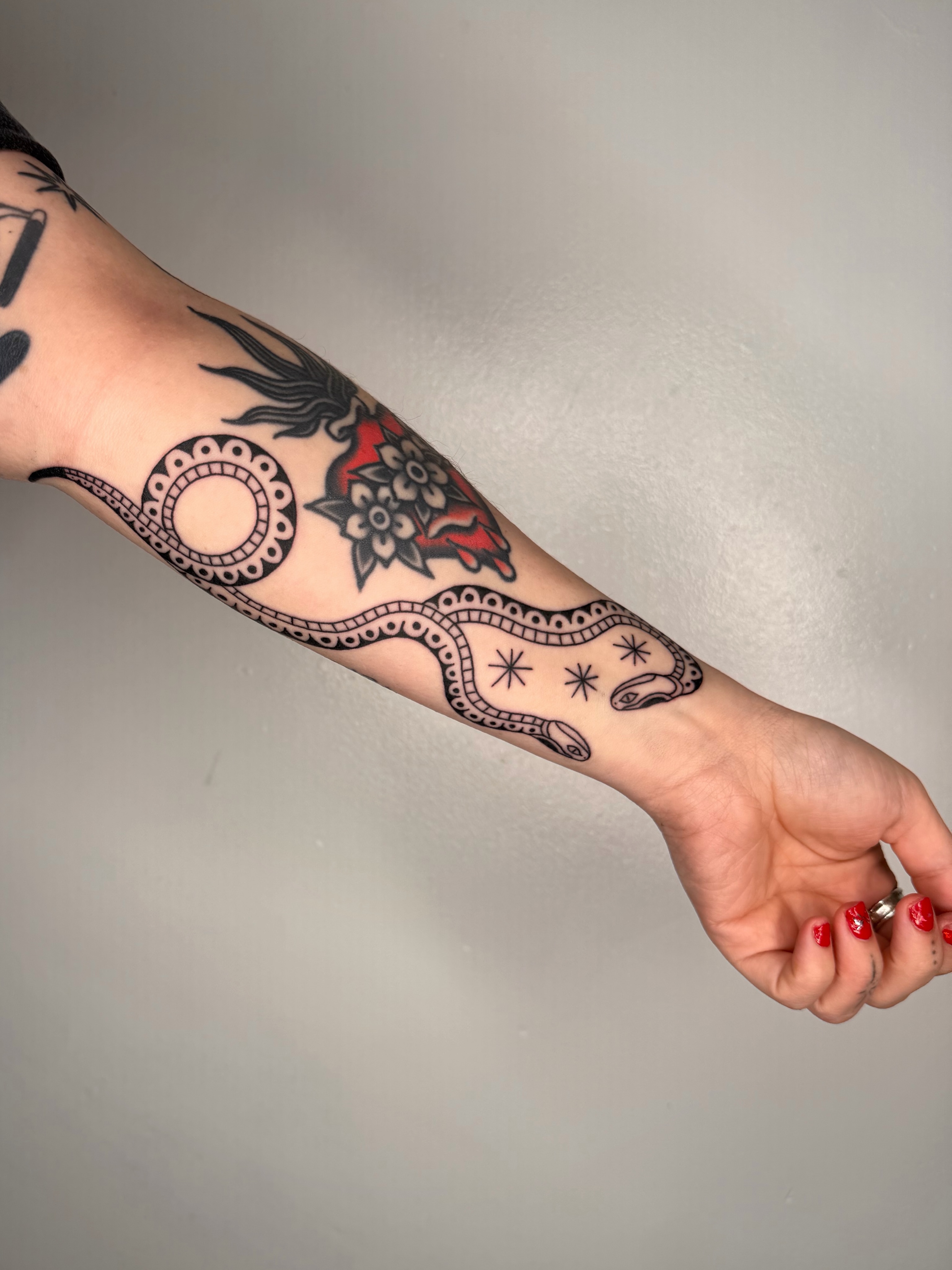 Snake and flower American traditional tattoo on the forearm by เผ เผถ ๐ฐ๐๐๐๐๐๐ เผถ ๐๐๐ถ เผถ เผ