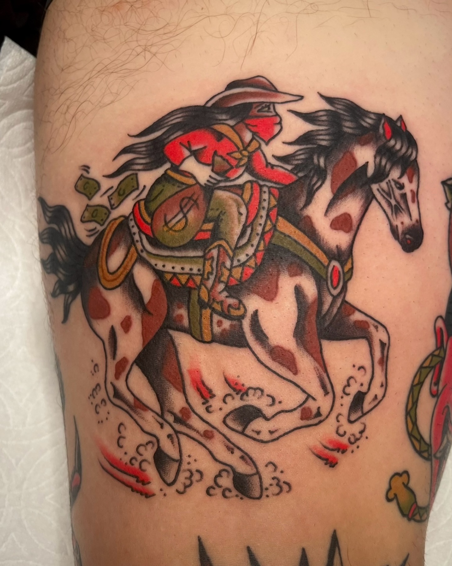 Cowboy on horse American traditional tattoo on the thigh by Tiffani Thompson, San Diego, California