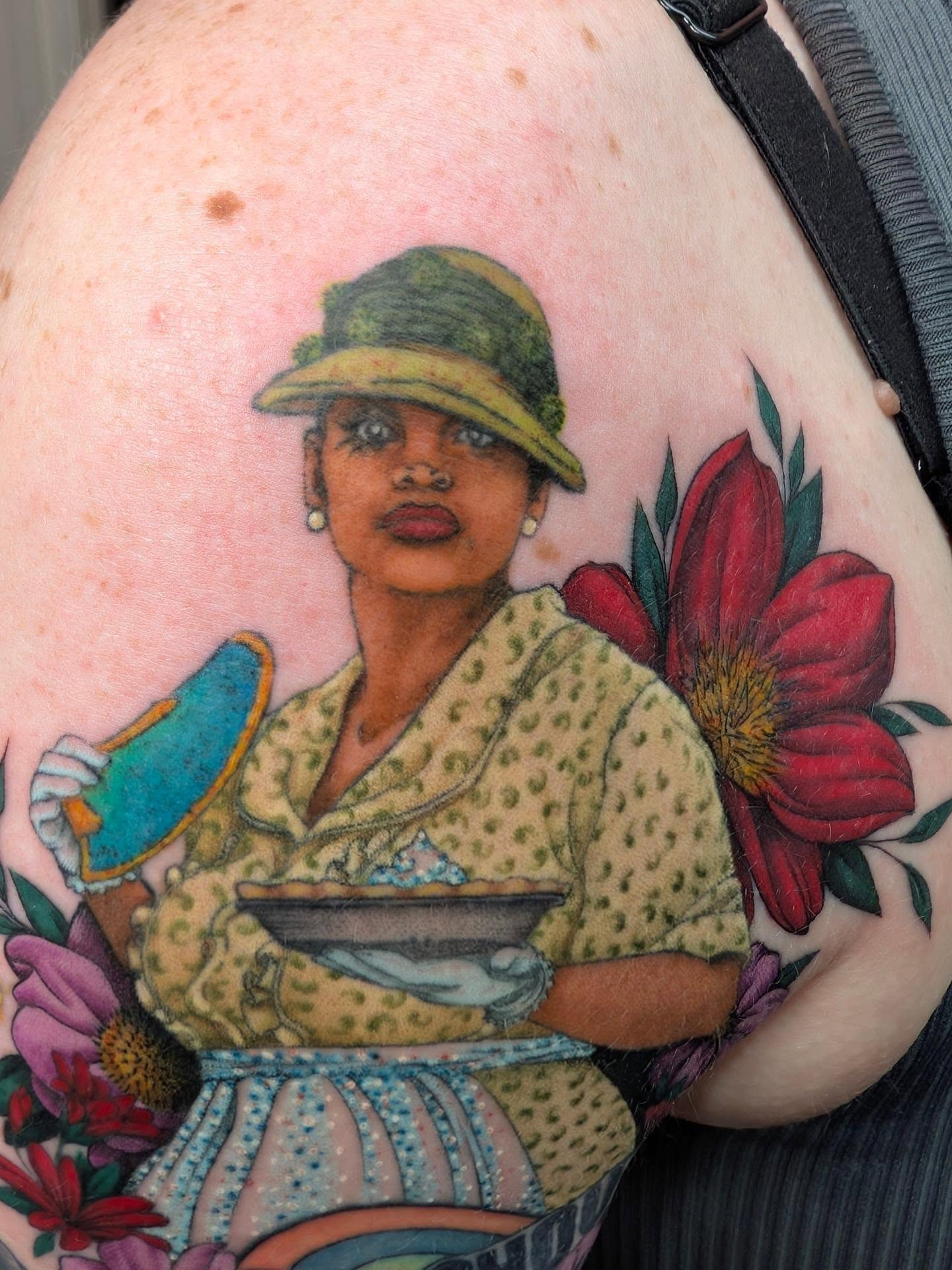 Woman with hat American traditional tattoo on the shoulder by Jessica Thomas Fleischman, Morganton, North Carolina