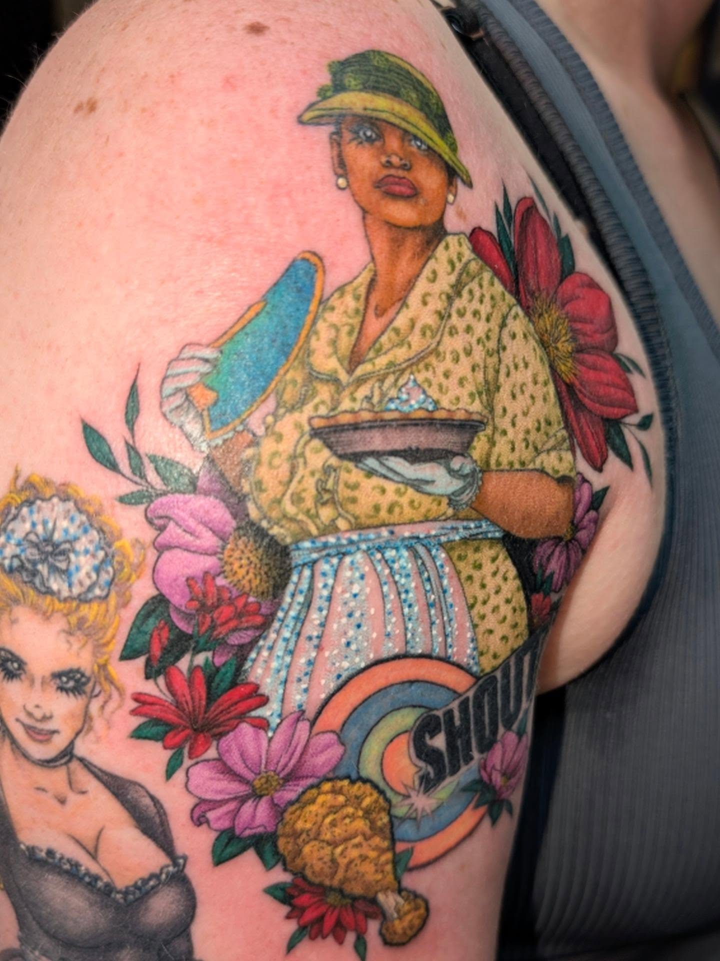 Woman with pie American traditional tattoo on the upper arm by Jessica Thomas Fleischman, Morganton, North Carolina