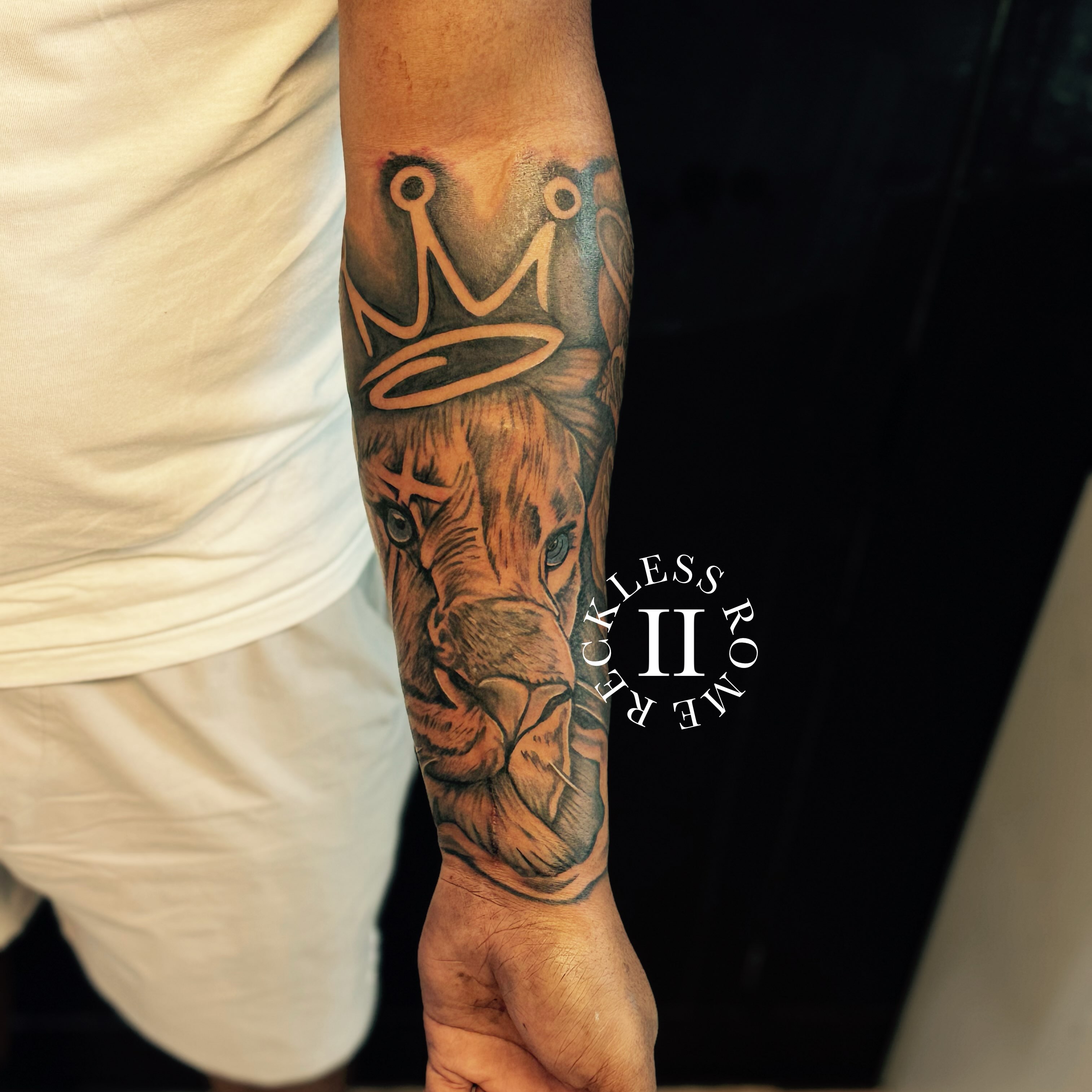 Elephant with crown realism tattoo on the forearm by Rome