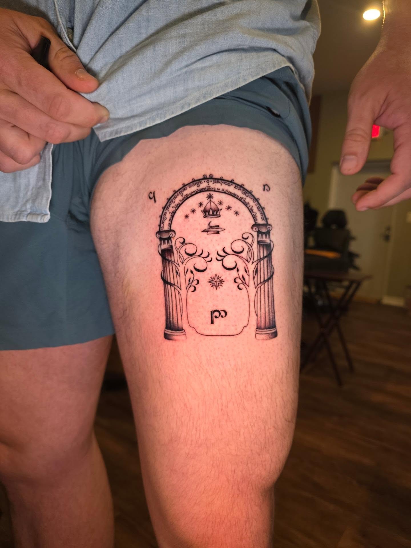 Archway with celestial symbols black and grey tattoo on the thigh by Maggie