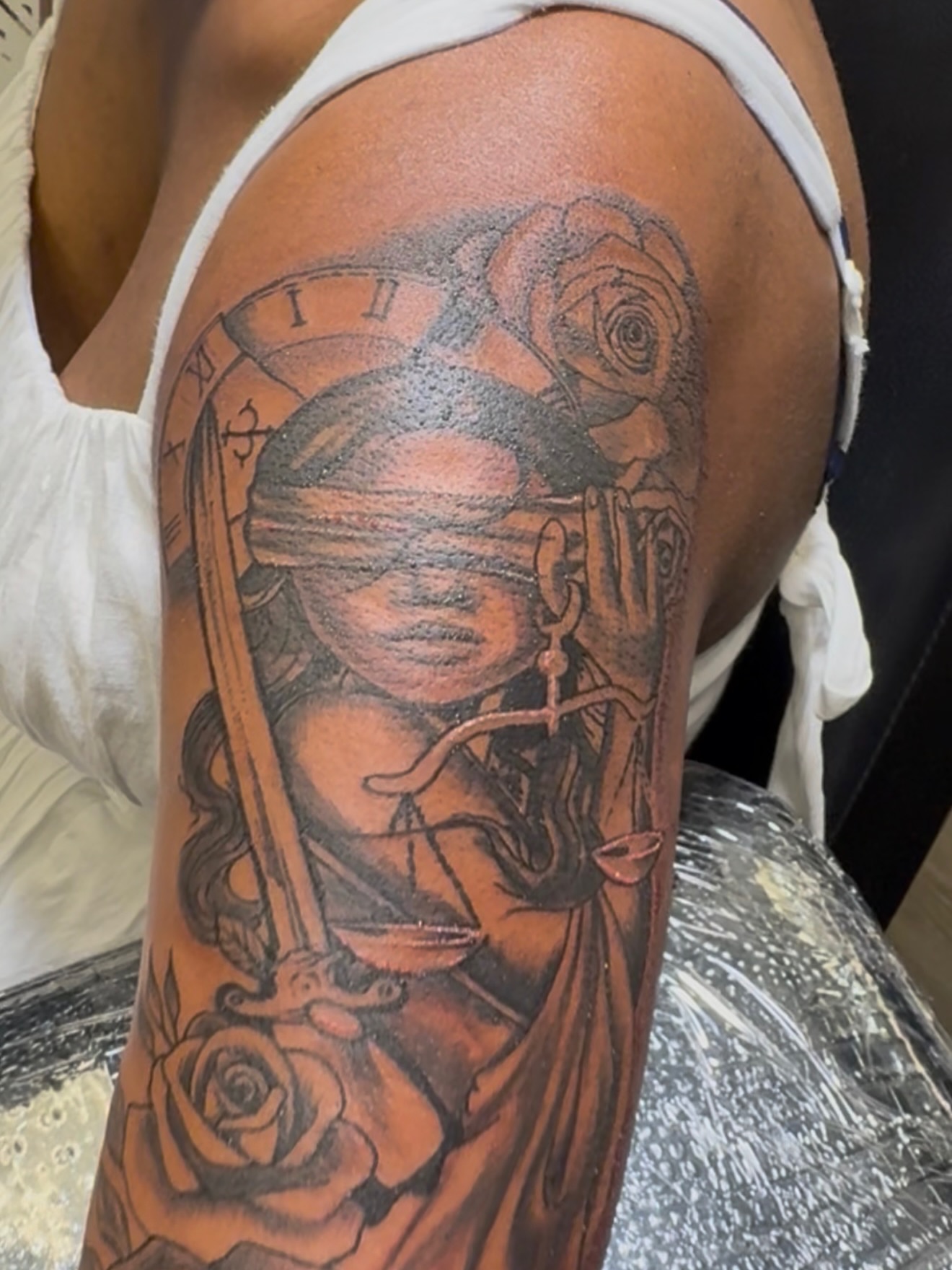 Justice figure realism tattoo on the forearm by Shine Jefferson, Memphis, Tennessee