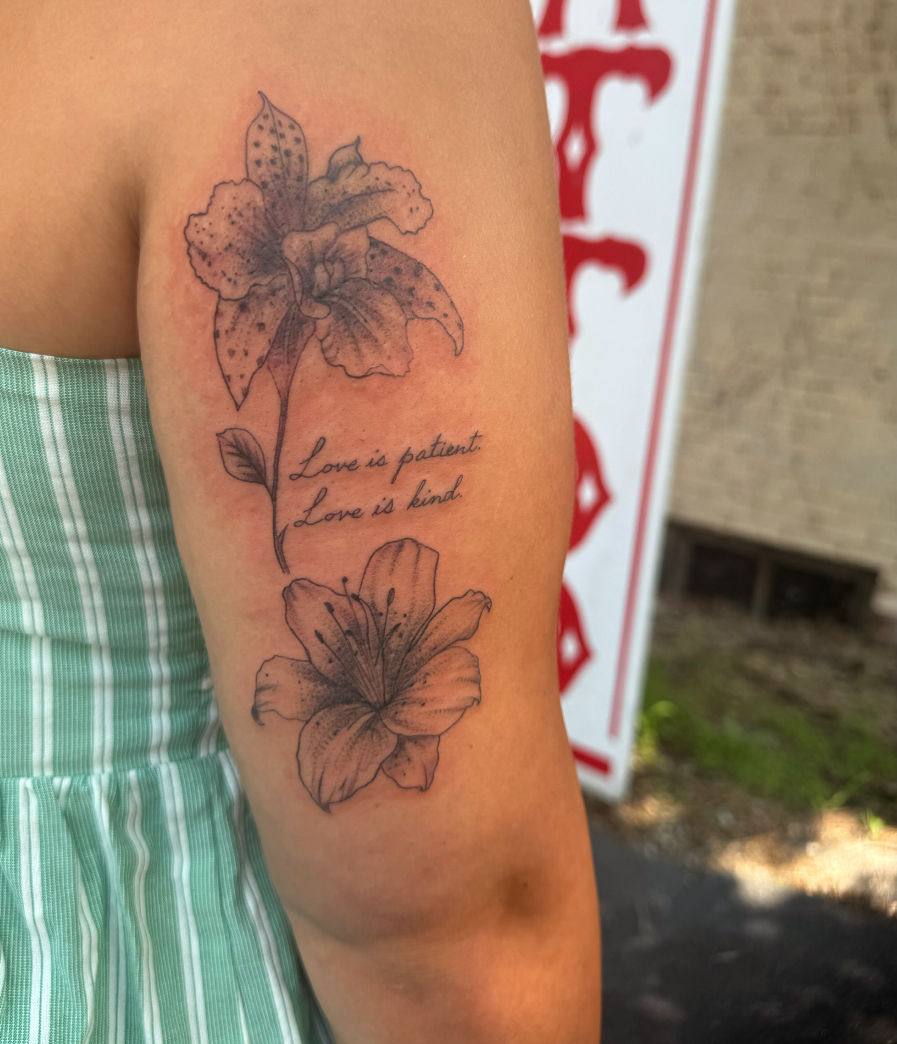Flowers and script black and grey tattoo on the forearm by Chris Adkins Tattoos, Chattanooga, Tennessee