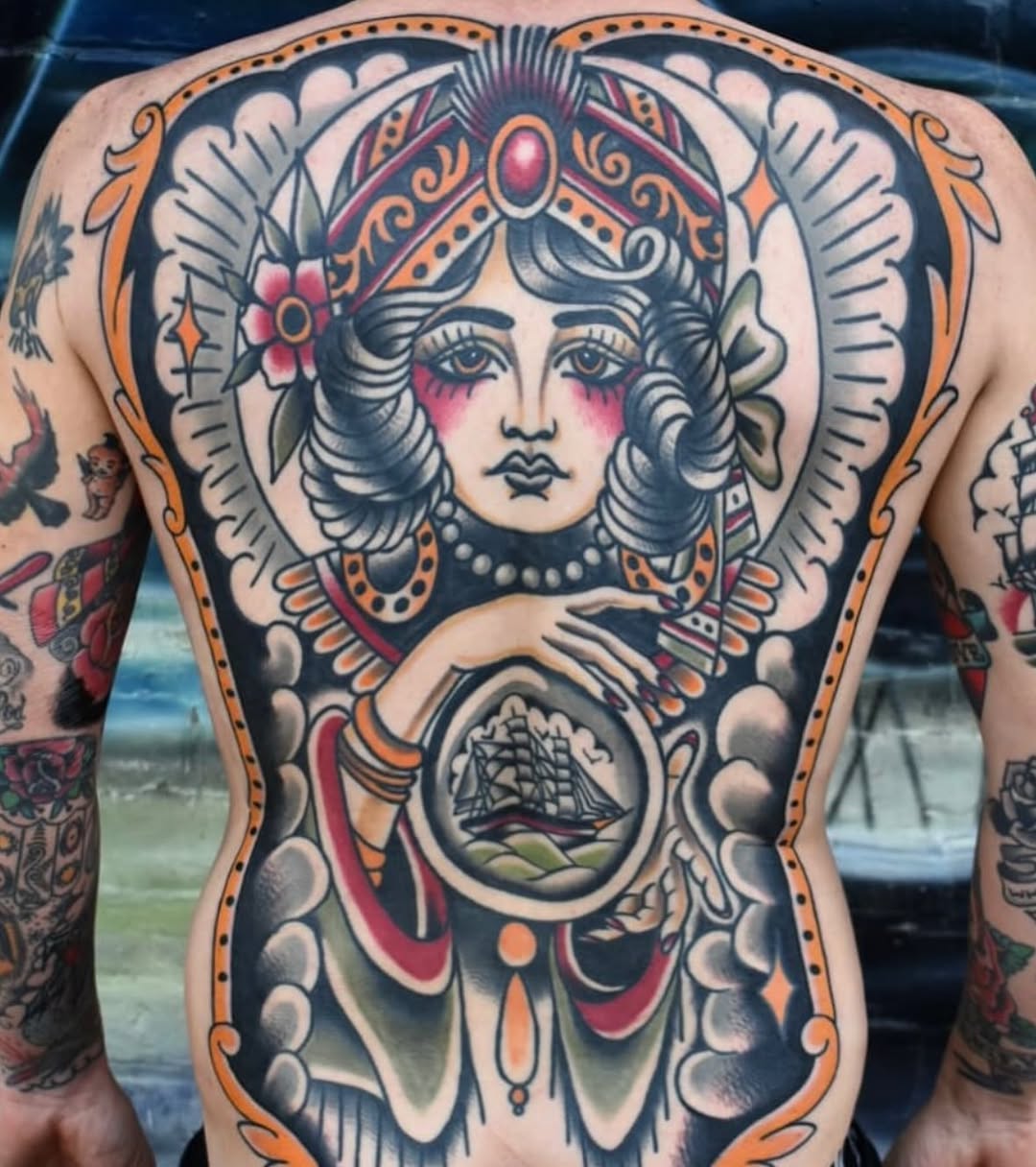 Neo-traditional tattoo on the back by Bobby Ellis