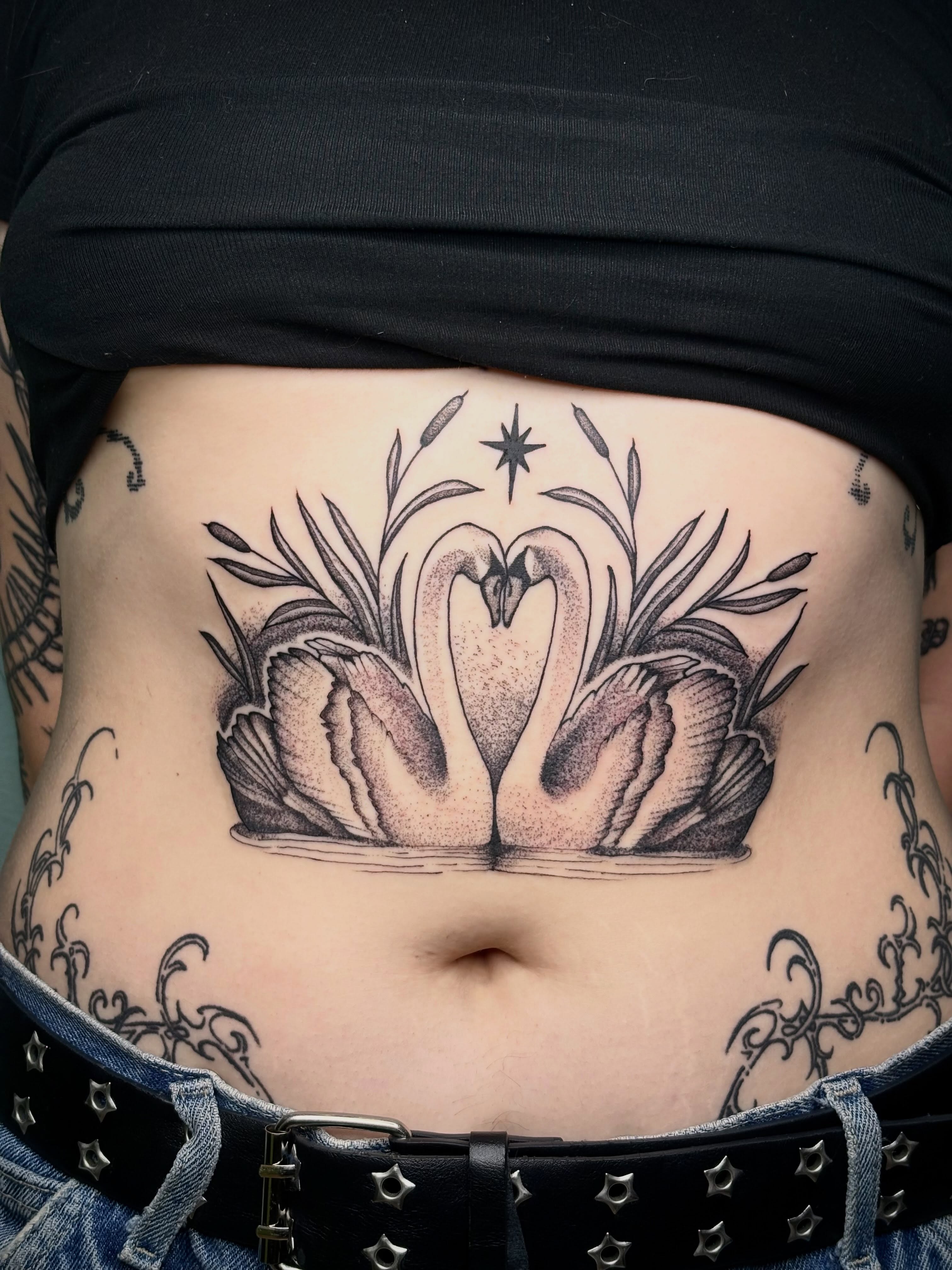 Swans dotwork tattoo on the torso by Sydney Pflaumer