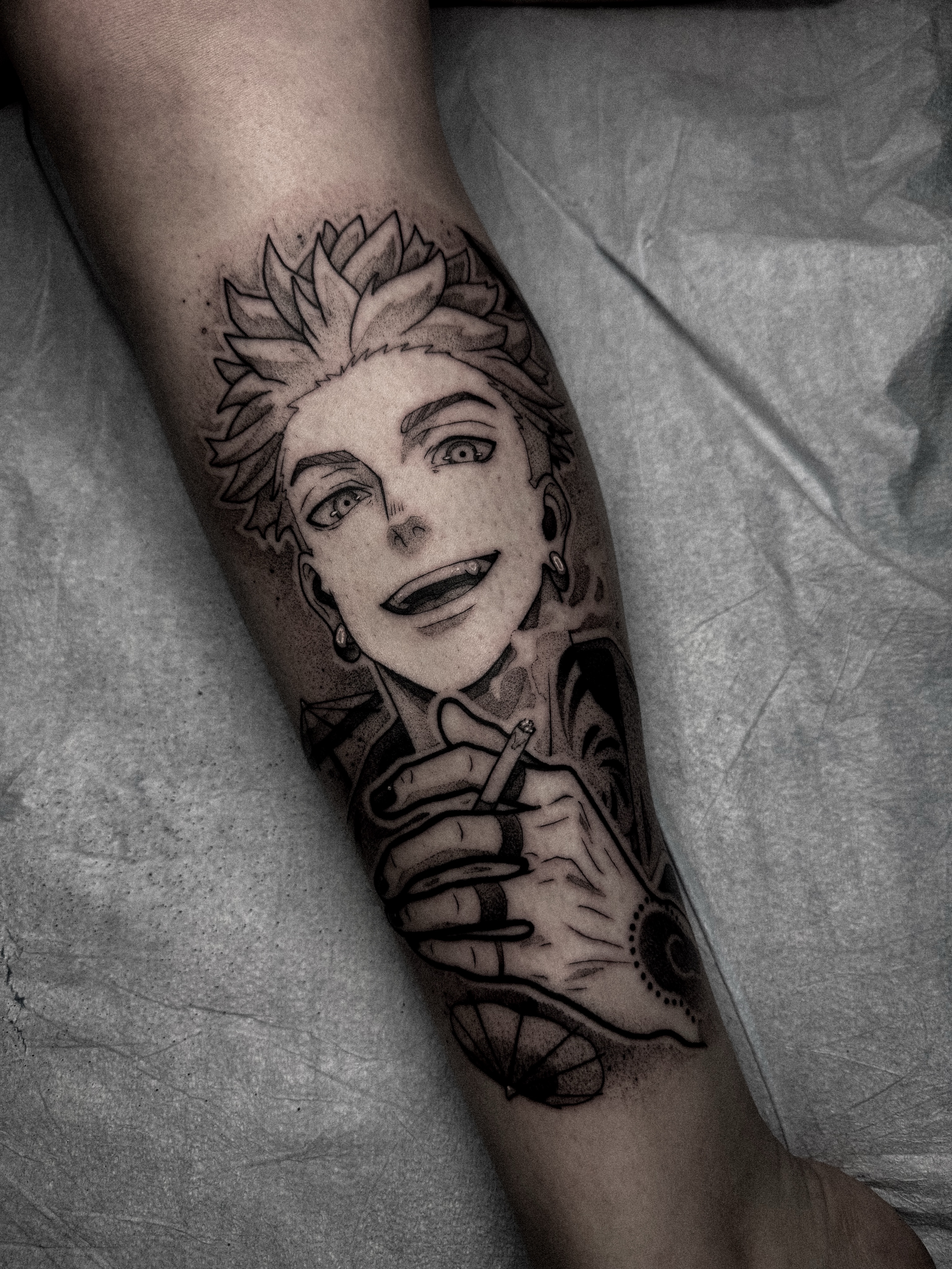 Anime character dotwork tattoo on the forearm by Dane Bezeau