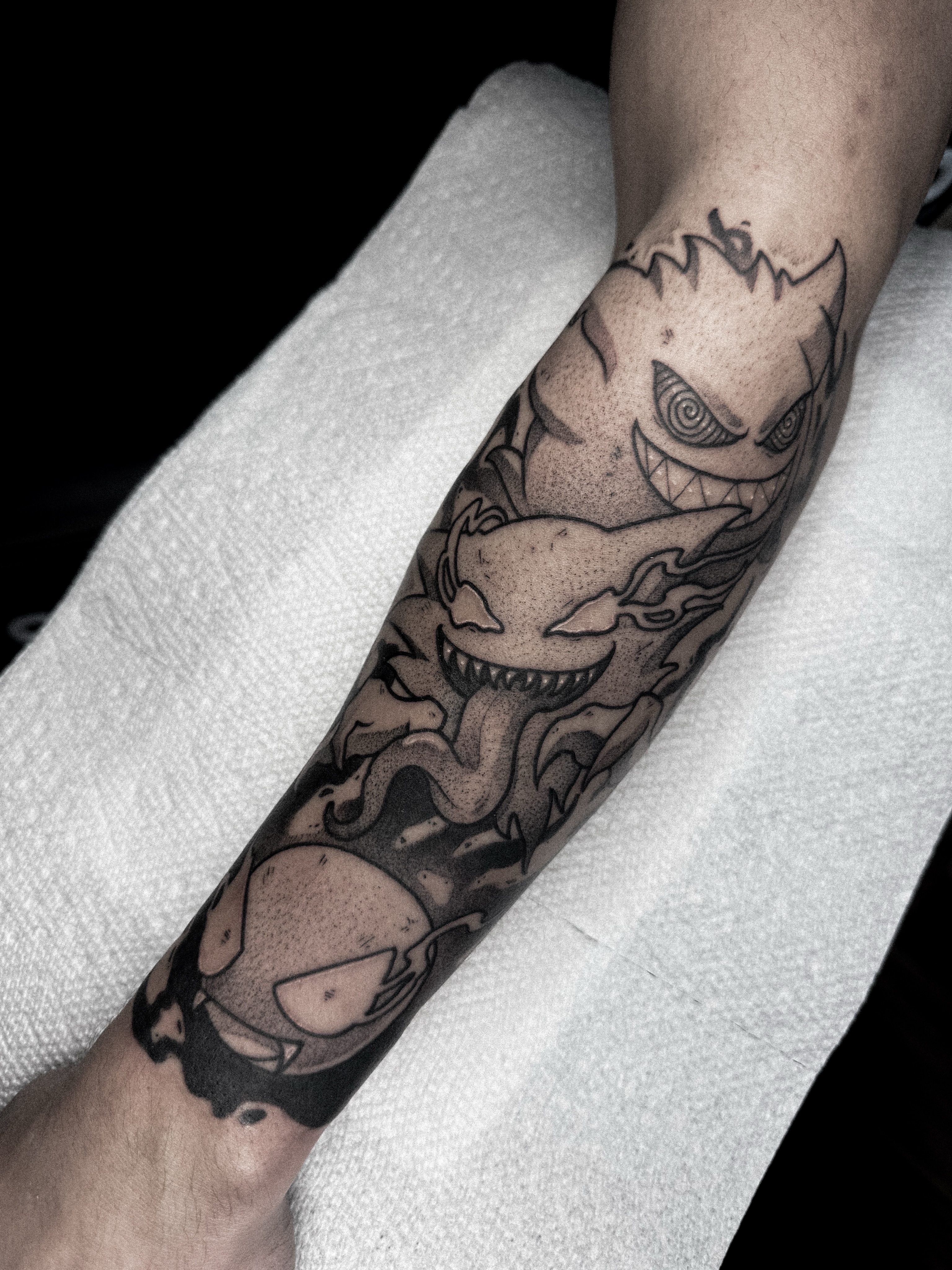 Ghostly creatures dotwork tattoo on the forearm by Dane Bezeau