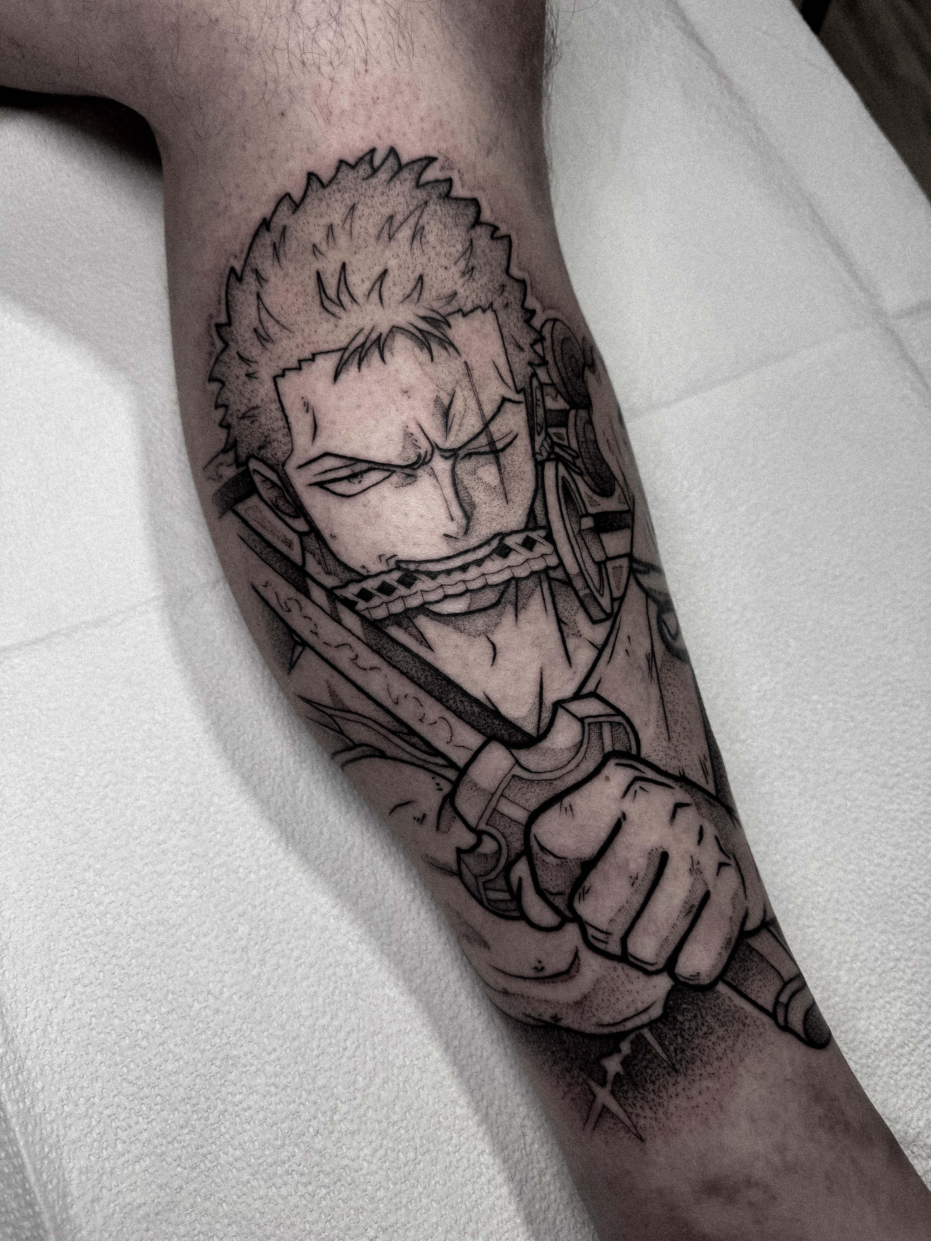 Anime character realism tattoo on the forearm by Dane Bezeau