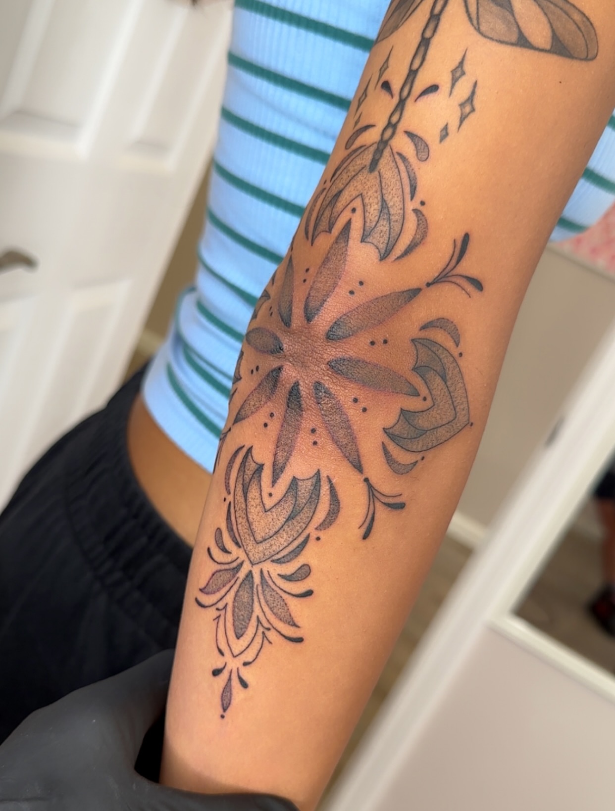 Lotus flower dotwork tattoo on the forearm by NuNu