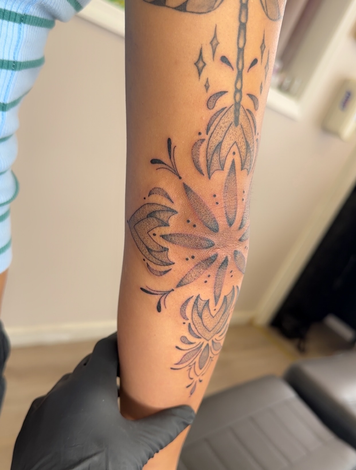 Floral mandala dotwork tattoo on the forearm by NuNu