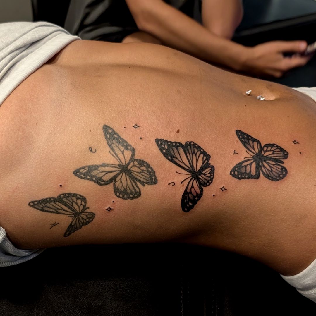 Butterflies black and grey tattoo on the ribs by Dave Chercourt, Willoughby, Ohio