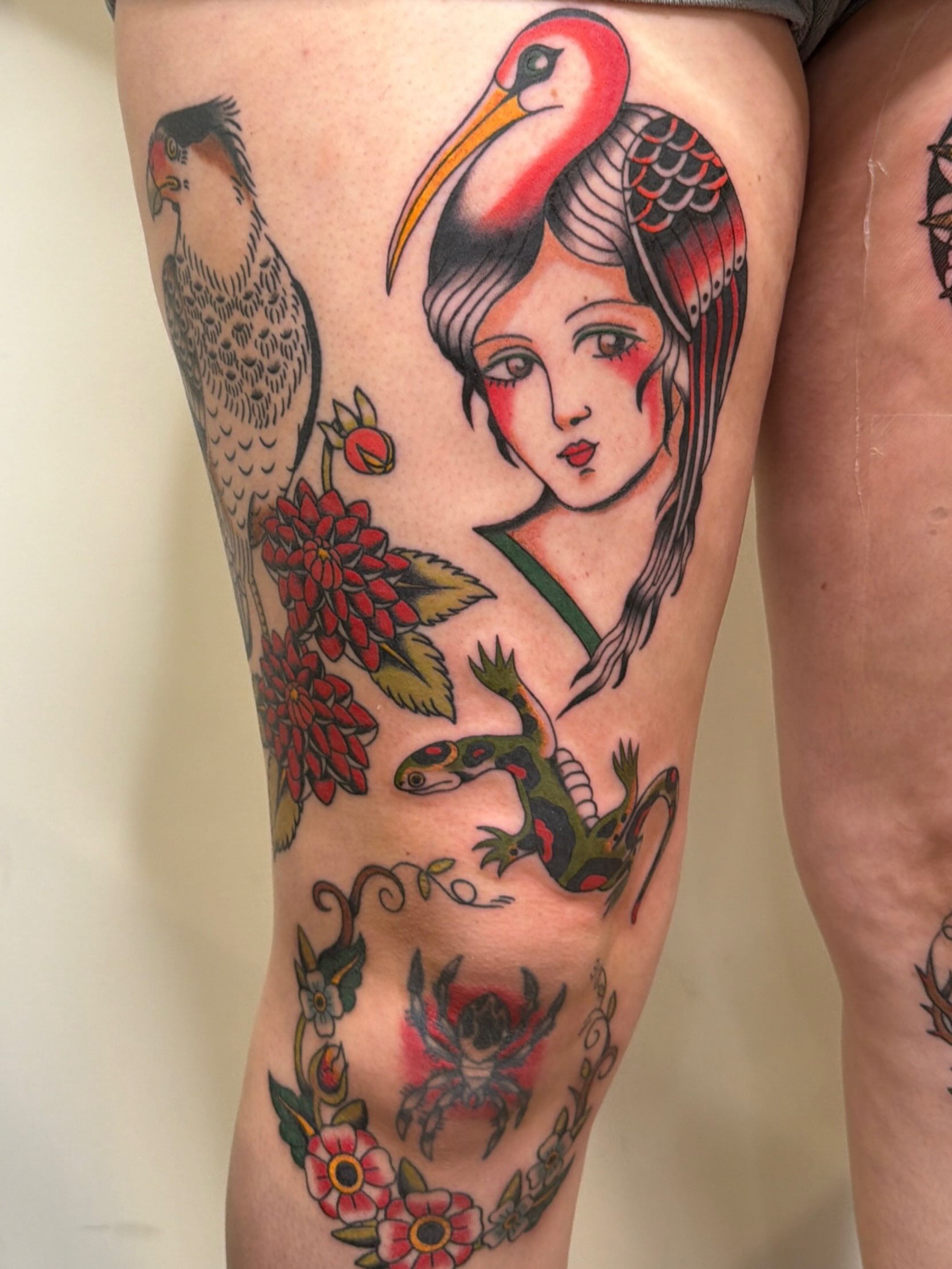 Geisha with crane and flowers American traditional tattoo on the thigh by Emma Fox Tattoo