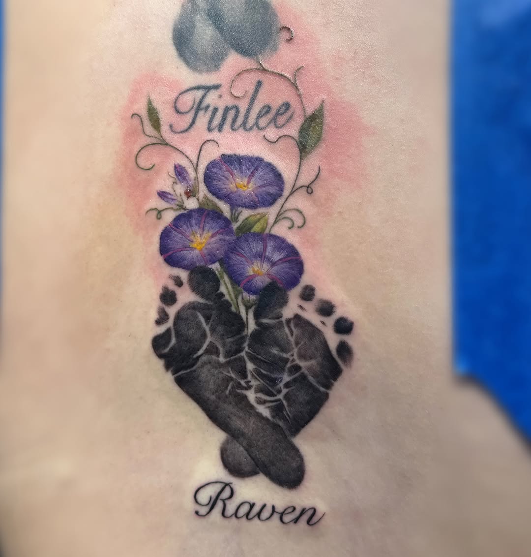 Baby footprints and flowers dotwork tattoo on the forearm by Elly Bordwell