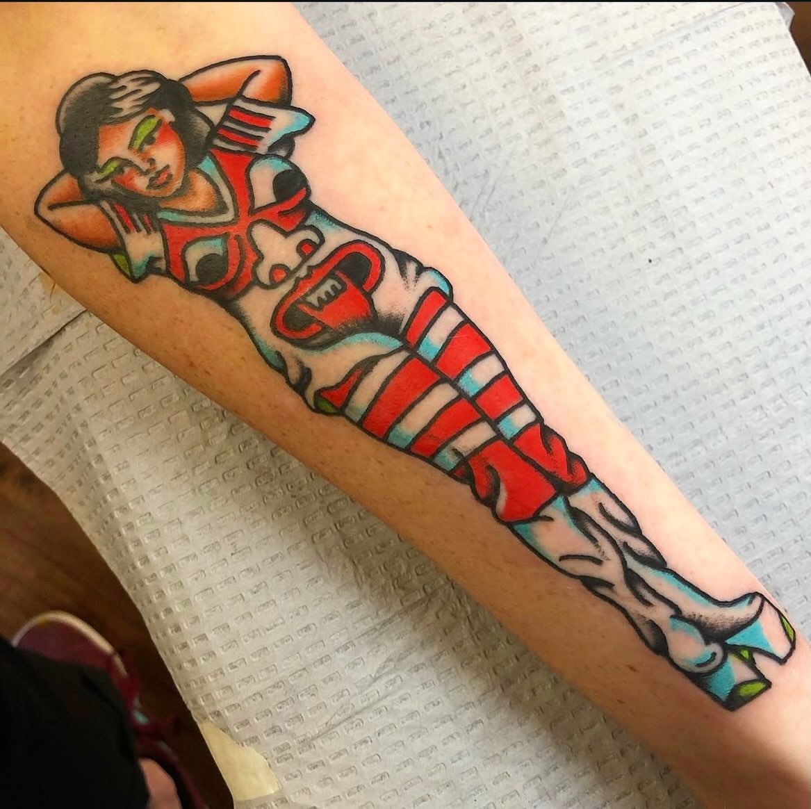 Football player American traditional tattoo on the forearm by Francis Kane