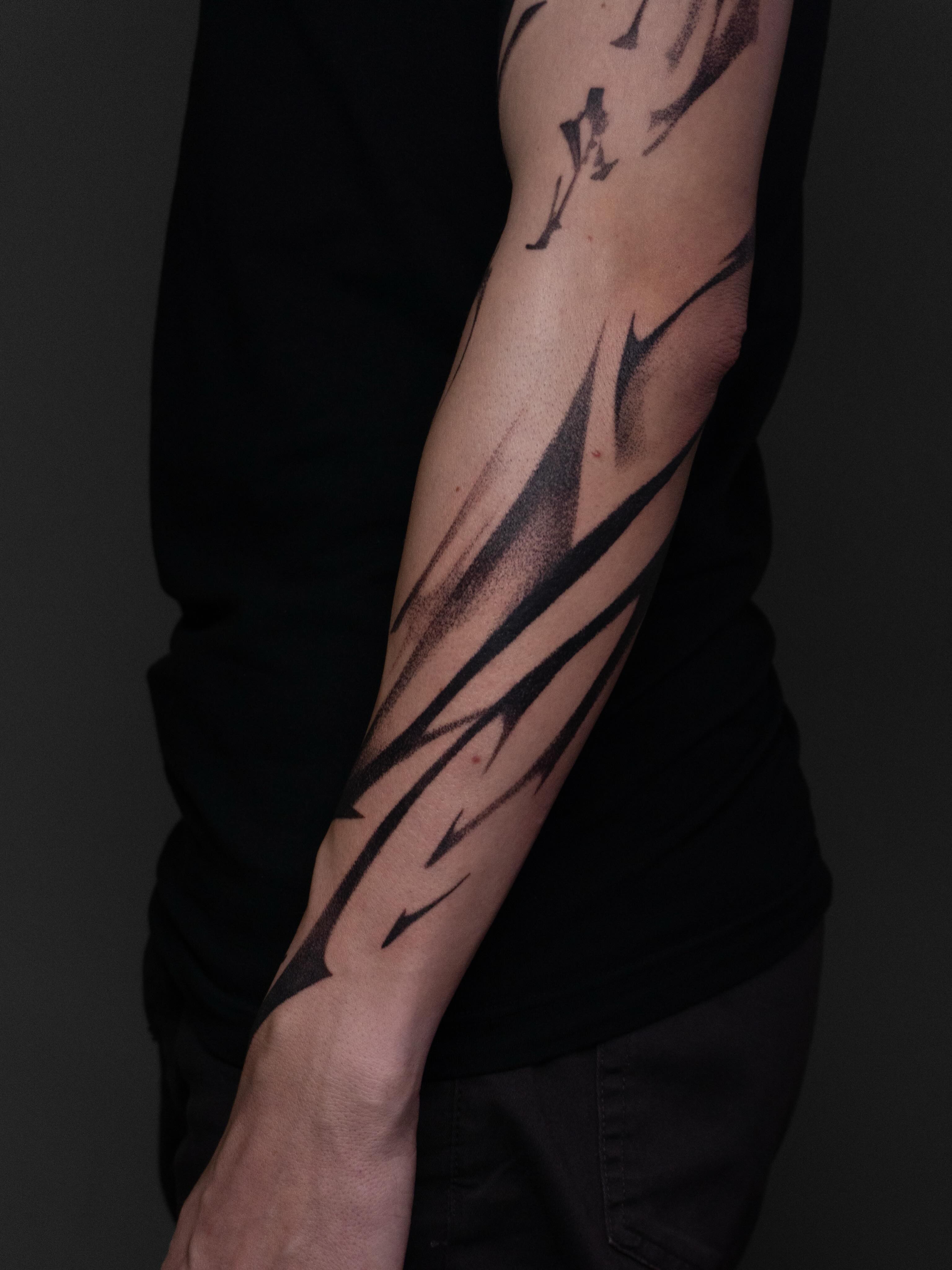 Abstract lines dotwork tattoo on the forearm by Pietro Moleti