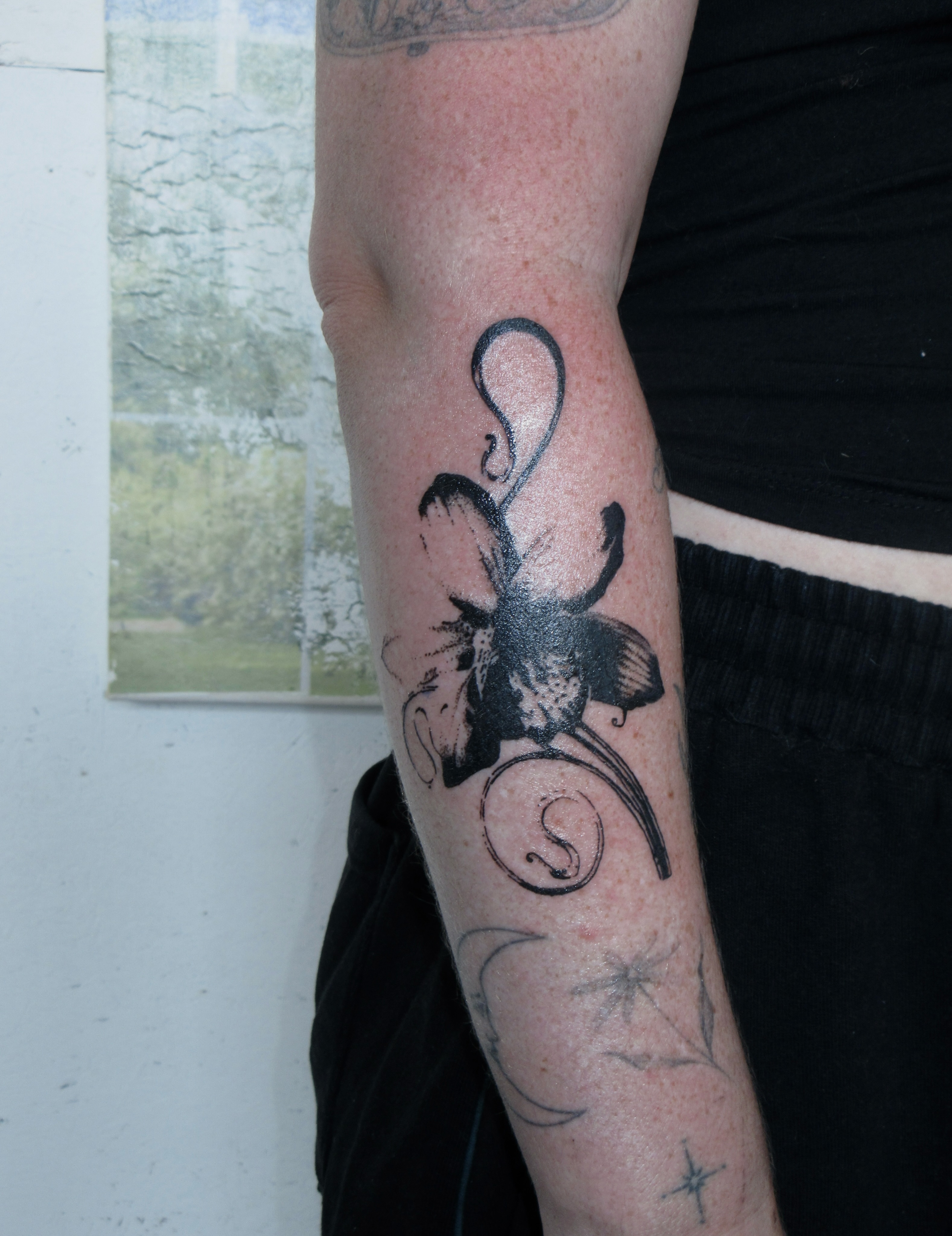 Fish black and grey tattoo on the forearm by bisabuelita