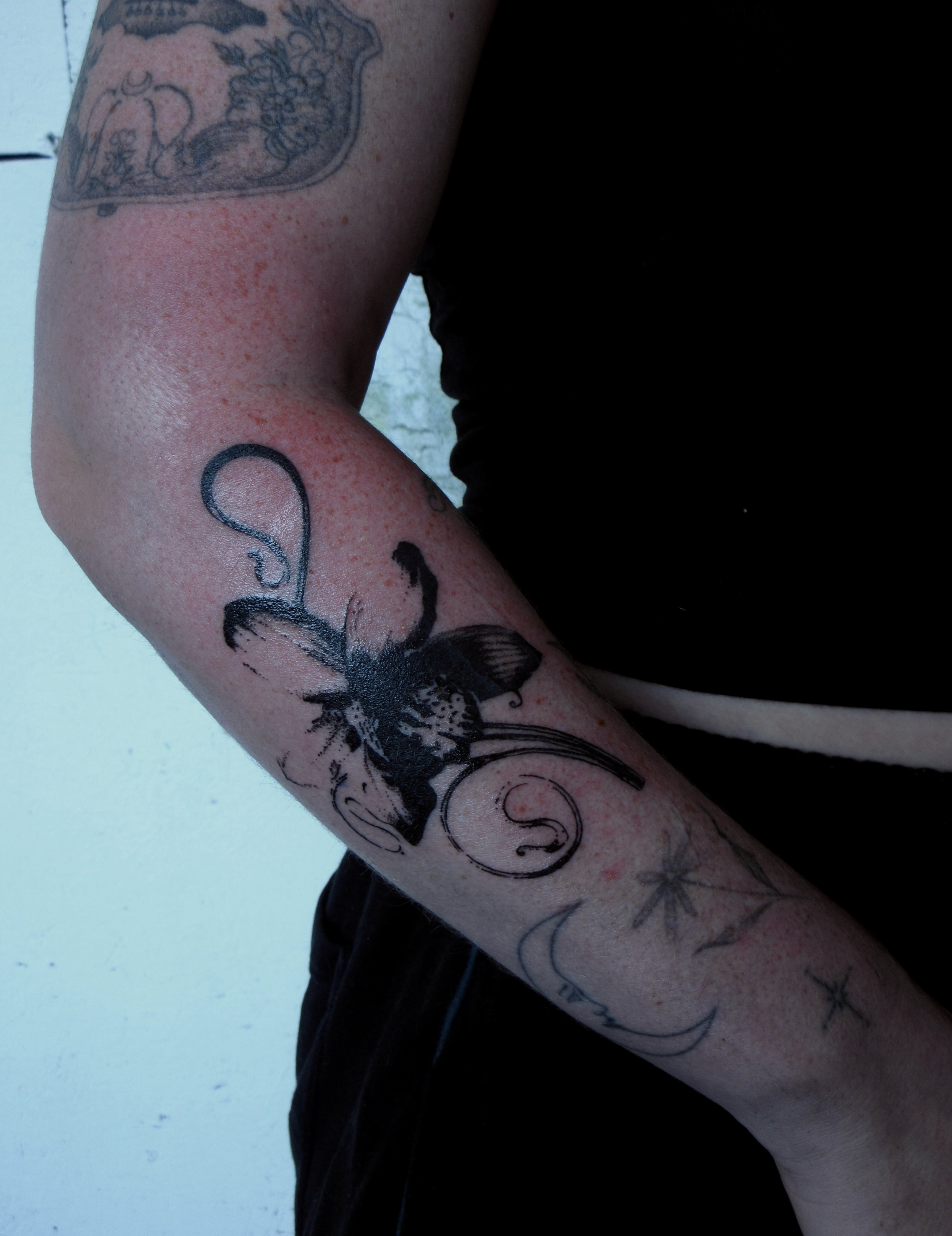 Insect black and grey tattoo on the forearm by bisabuelita