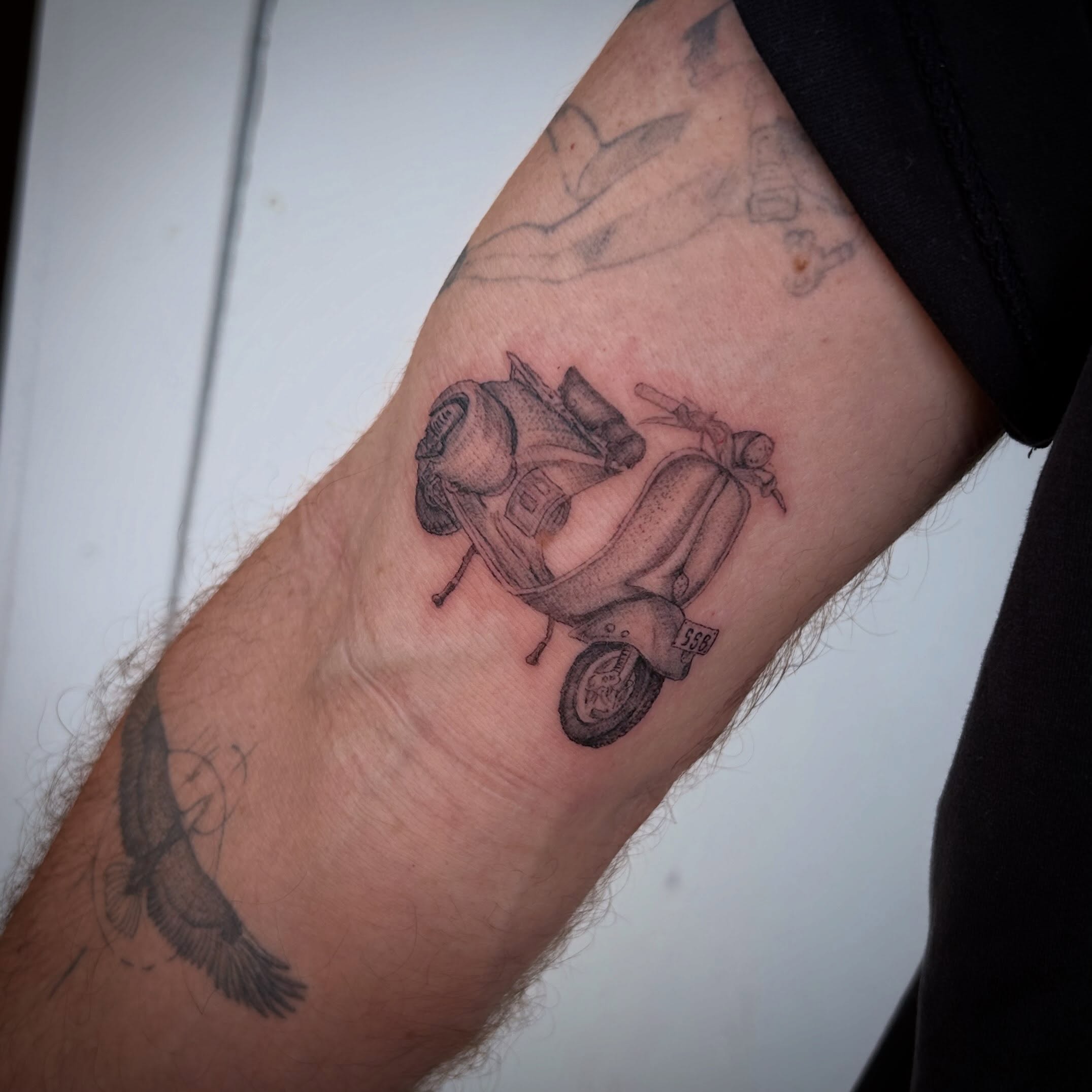 Vespa scooter black and grey tattoo on the forearm by Miss Katie