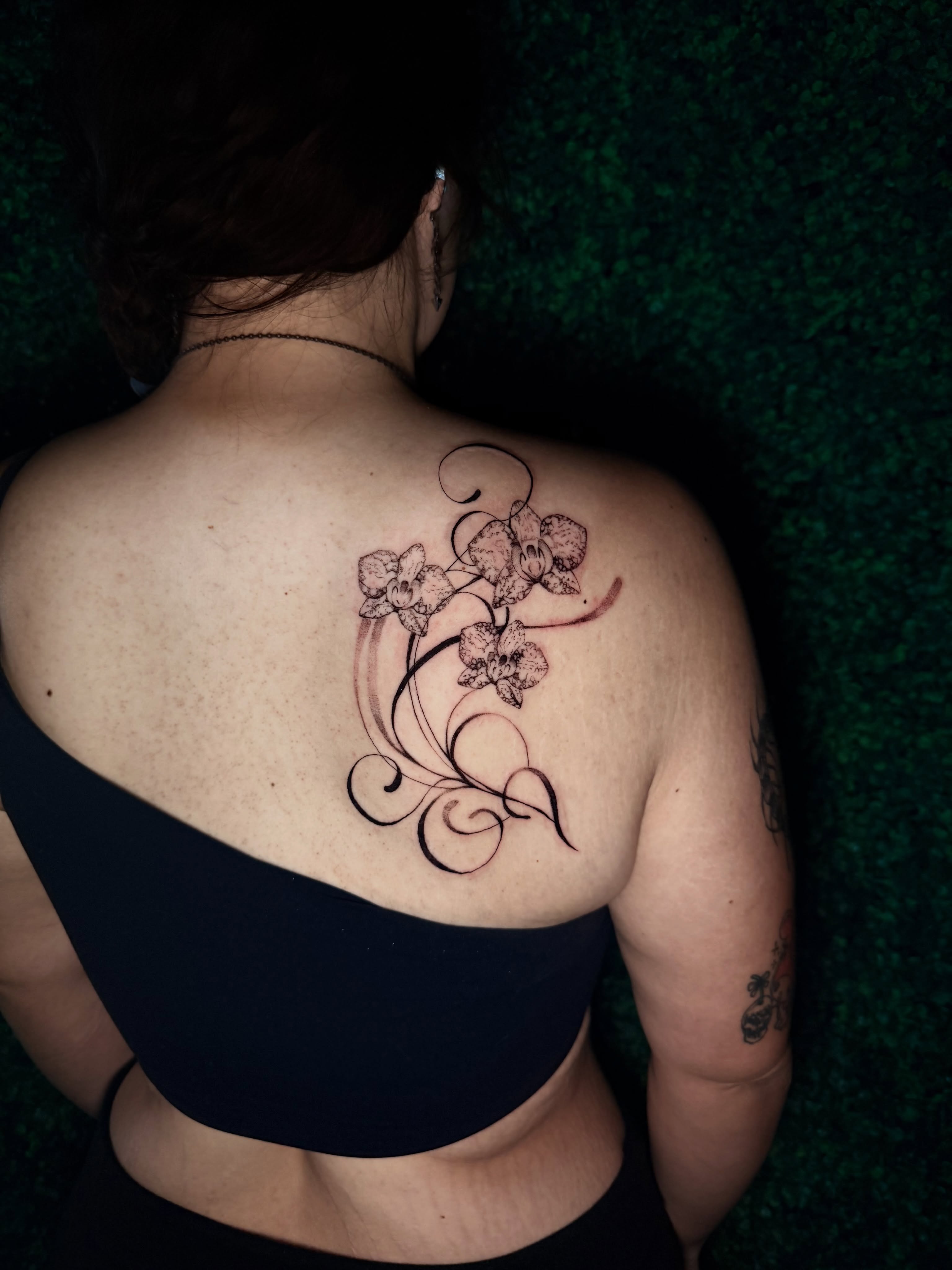 Orchid vine black and grey tattoo on the back by bella :)