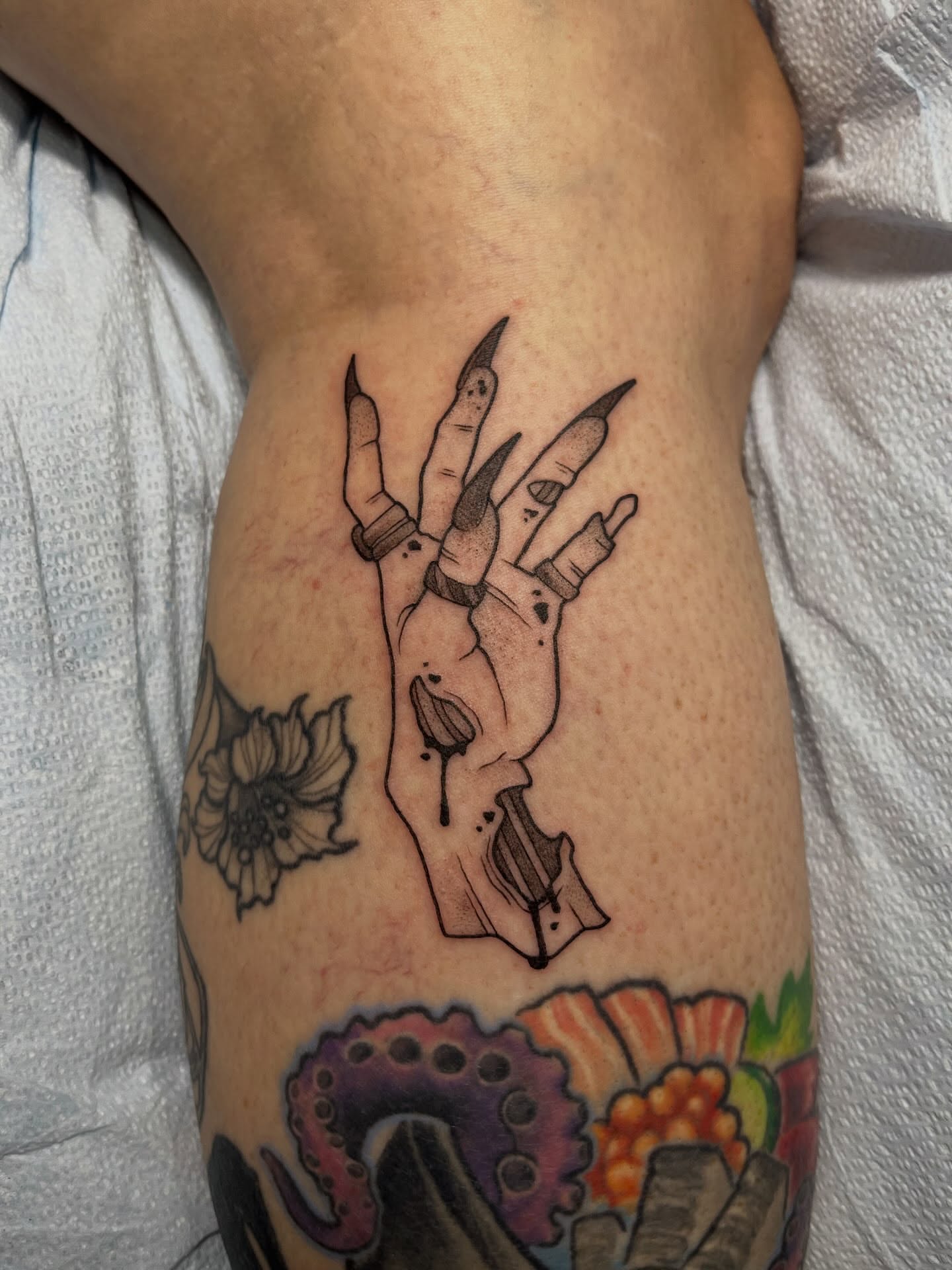 Hand with claws black and grey tattoo on the forearm by bunny, Minneapolis, Minnesota