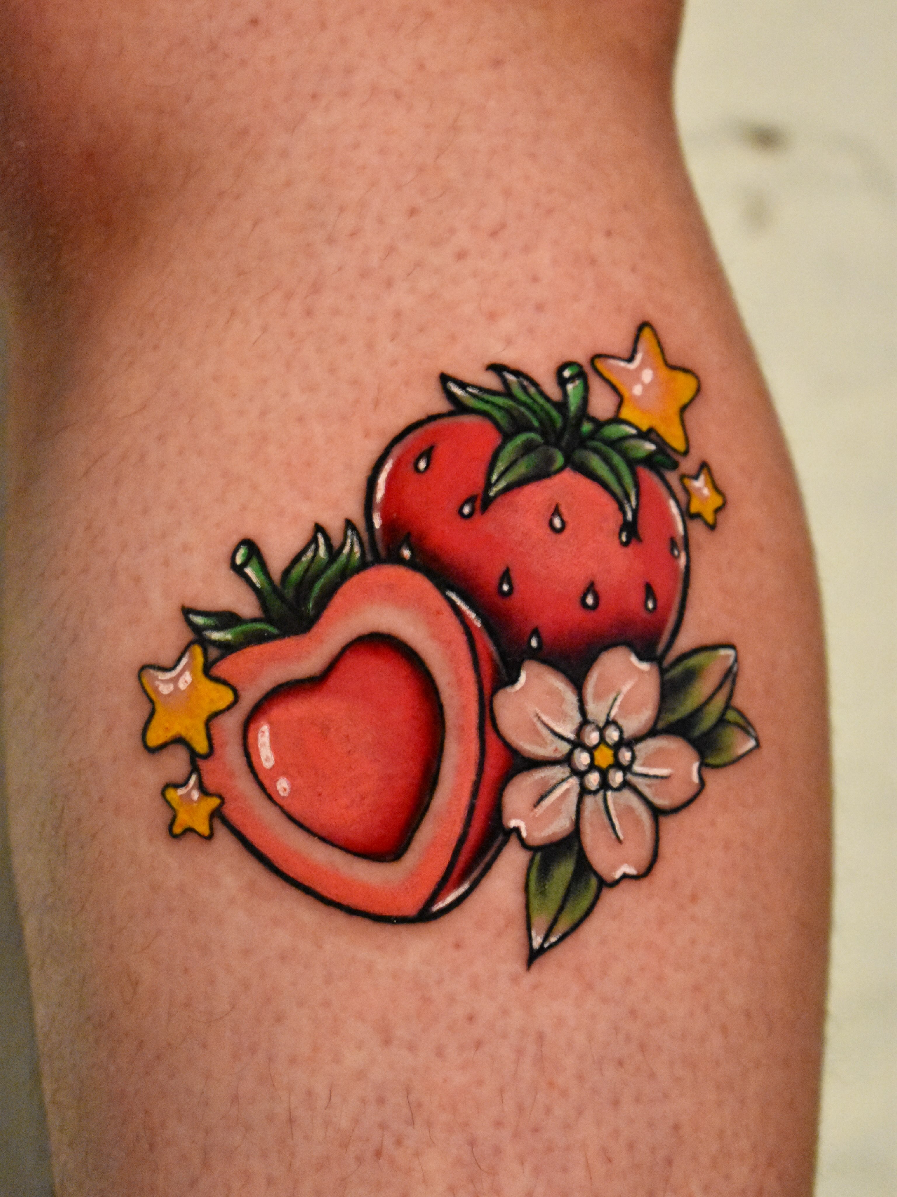 Strawberries and flower American traditional tattoo on the thigh by Mackz