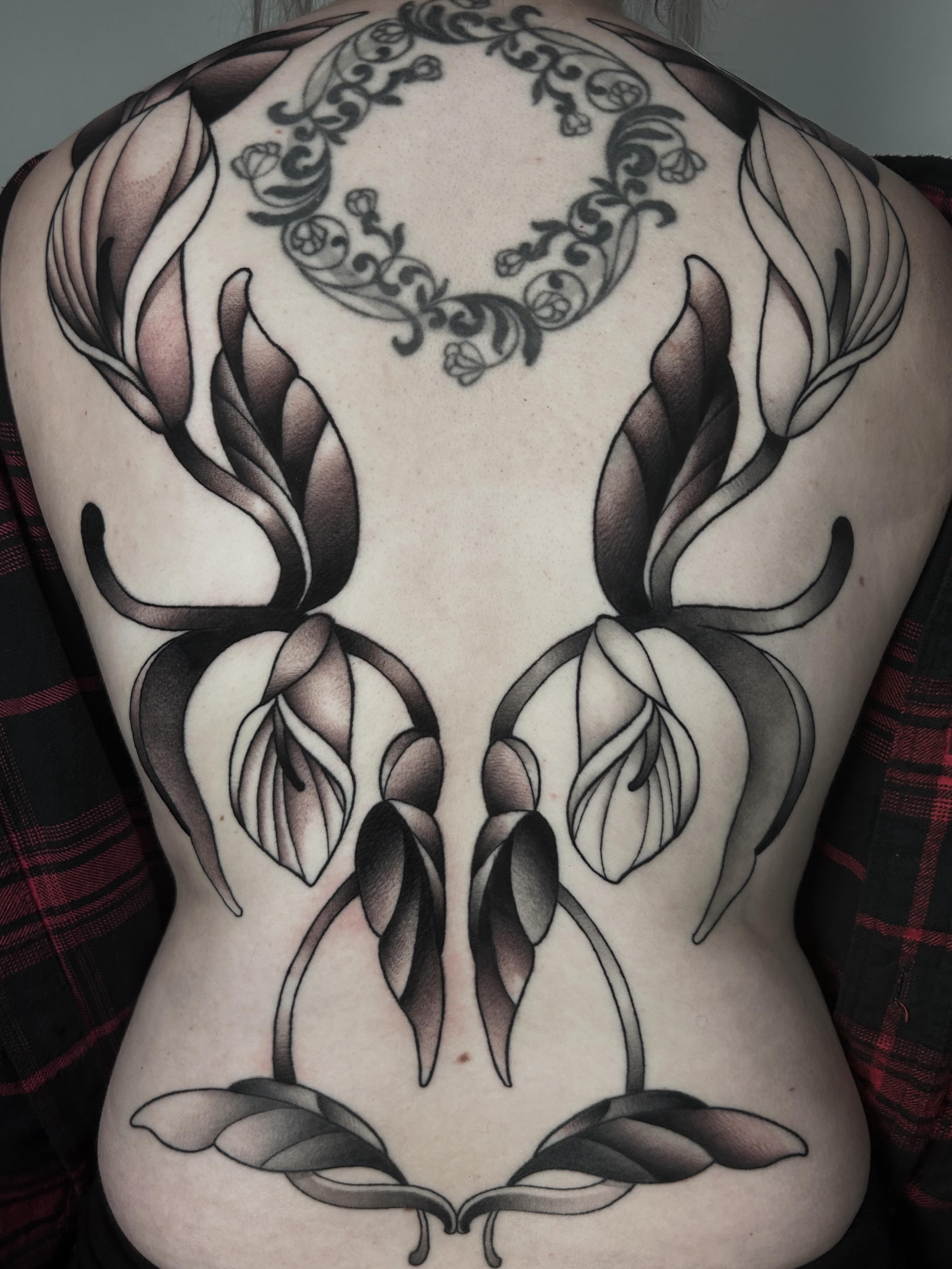Floral design black and grey tattoo on the back by Salt Lake City tattoo artist