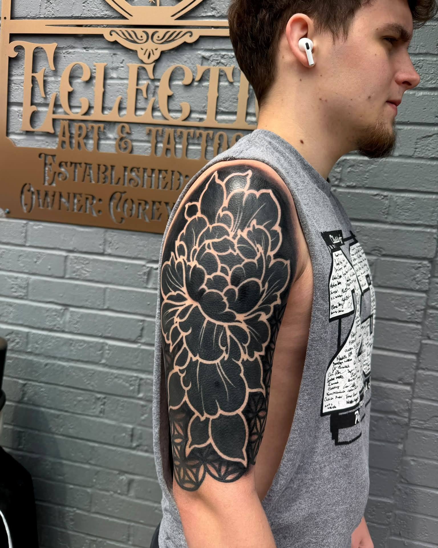 Floral design black and grey tattoo on the upper arm by Corey Bailey, Stanton, Kentucky