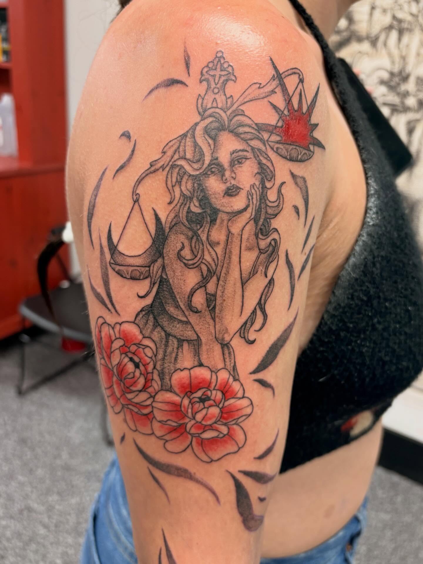 Libra woman with flowers neo-traditional tattoo on the shoulder by Jayda Shell