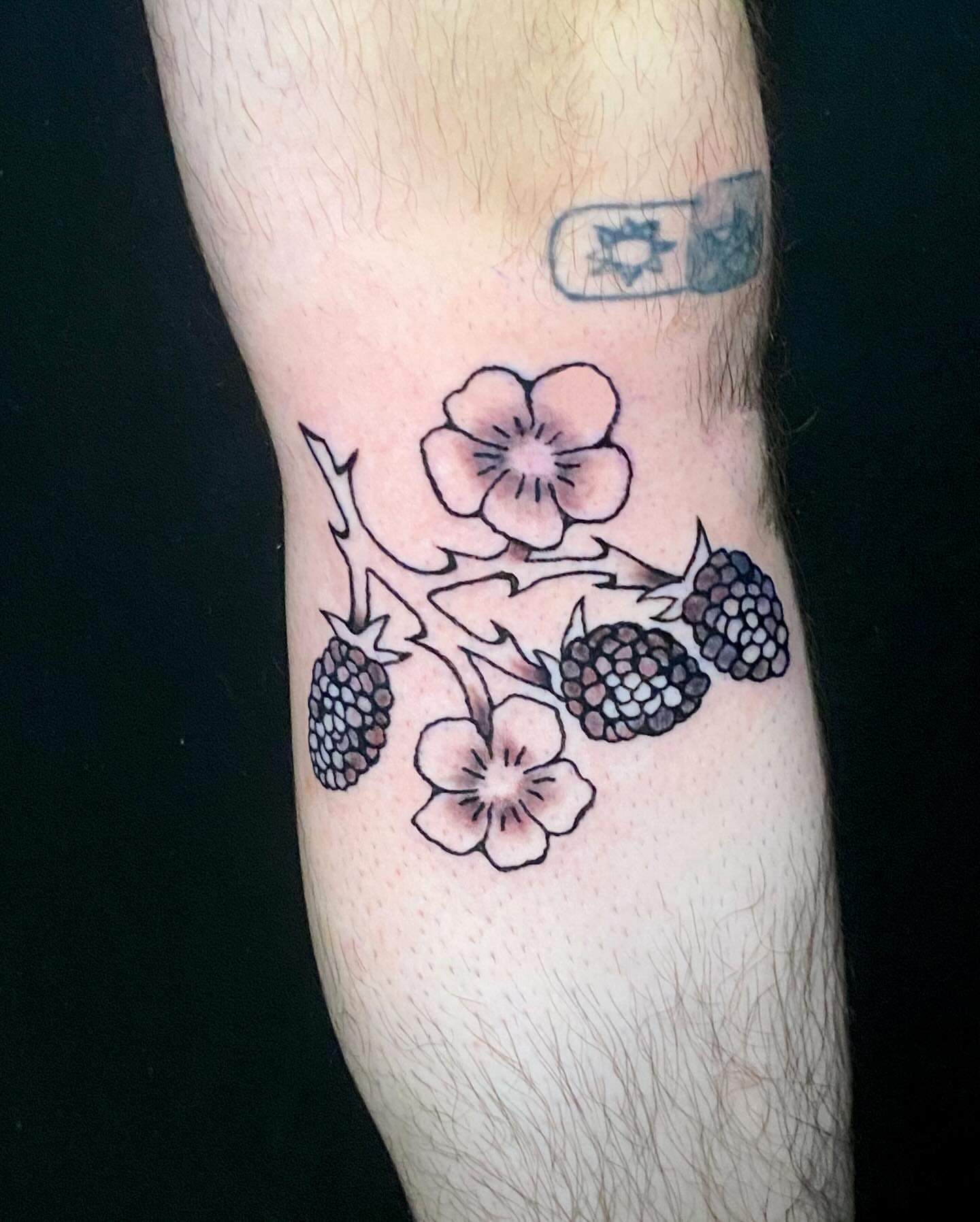 Flower and berries black and grey tattoo on the forearm by ollie, Portland, Oregon